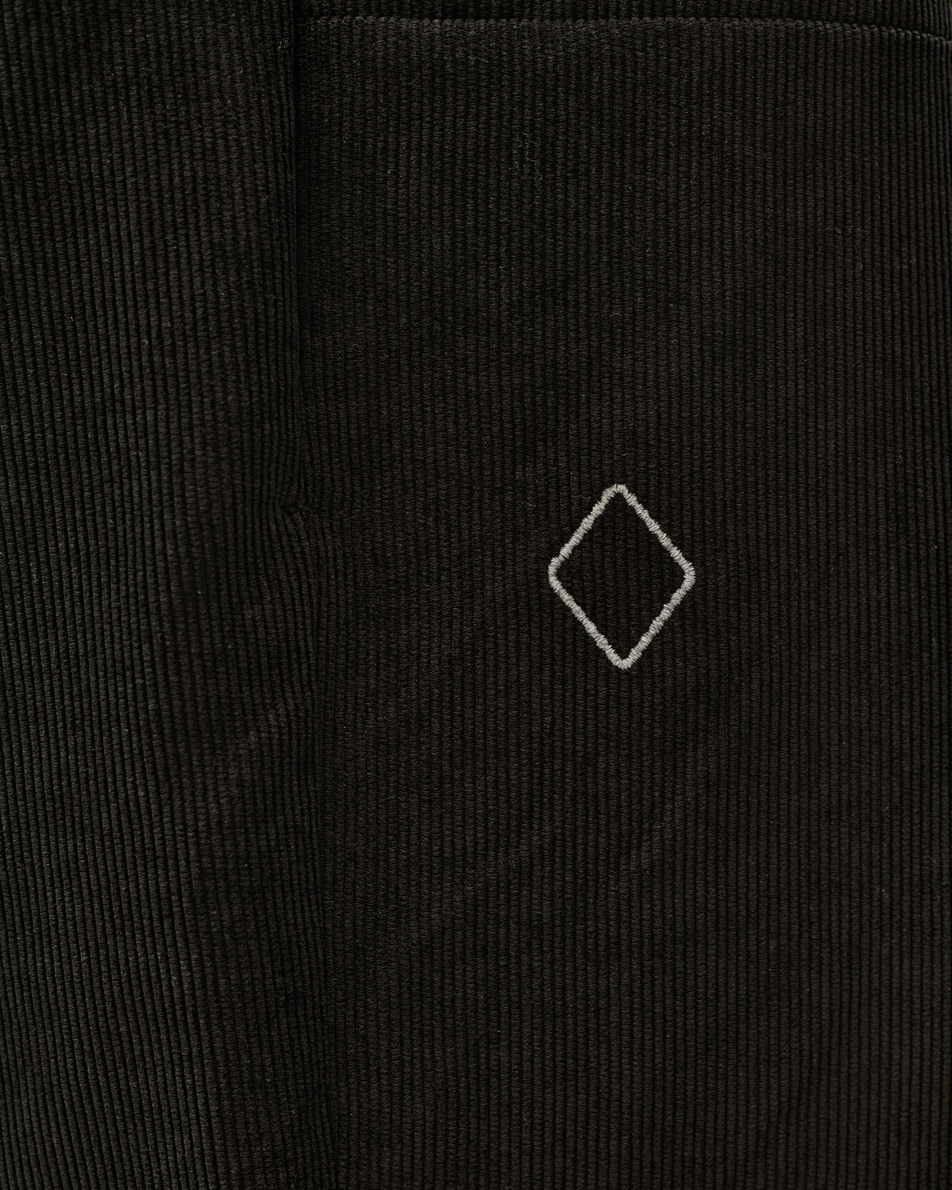 Black Off-Race Corduroy pants, detail view of corduroy texture with embroidered diamond logo