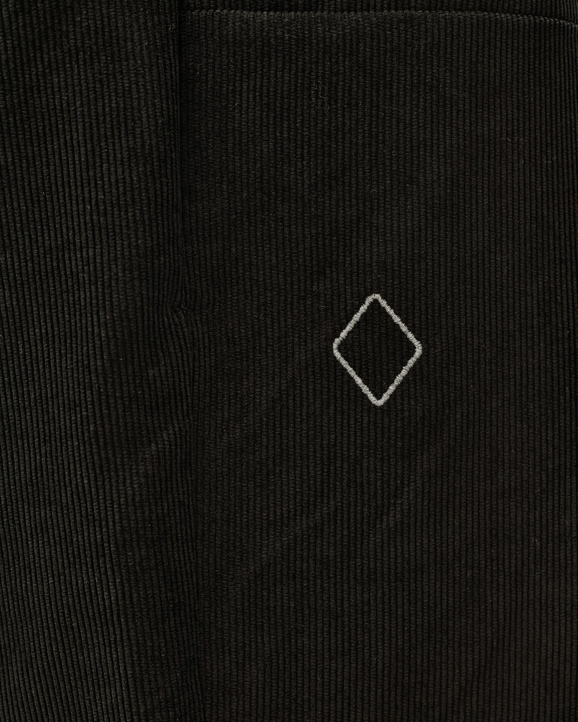 Black Off-Race Corduroy pants, detail view of corduroy texture with embroidered diamond logo