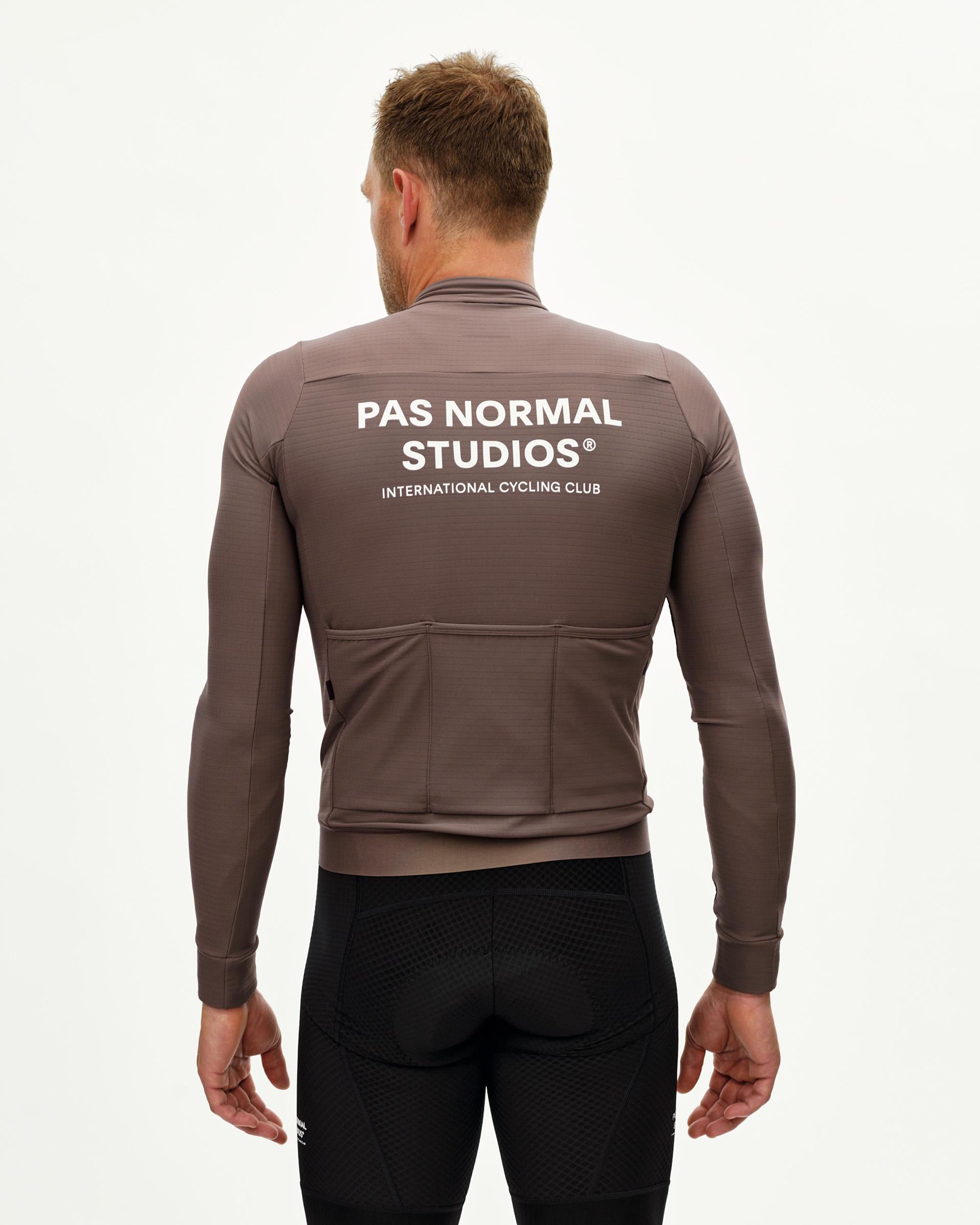 Dusty Plum Essential long sleeve cycling jersey on model, rear view with white back print