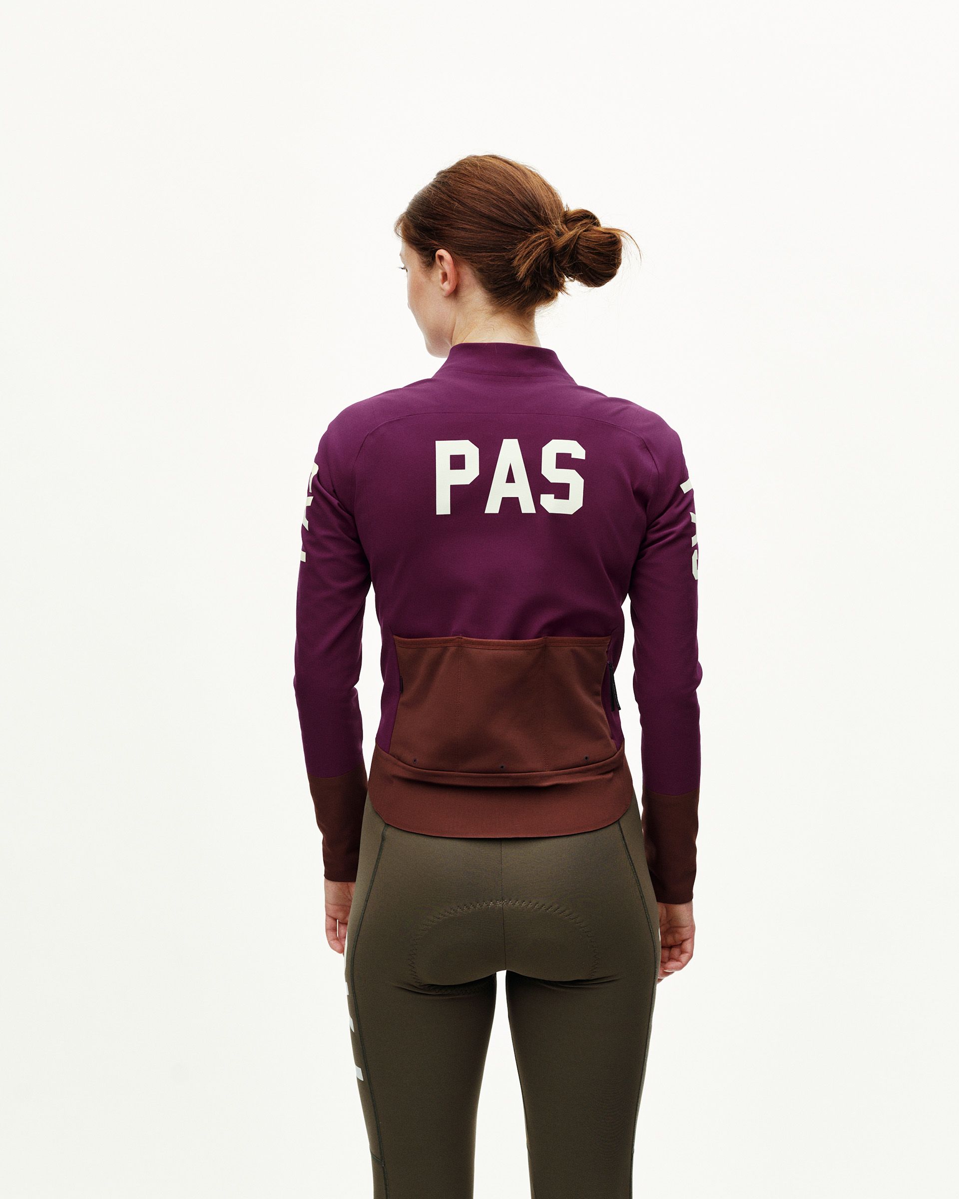 Dark Purple Mechanism Thermal cycling jacket on model, rear view with white back print and contrast brown rear pocket panel