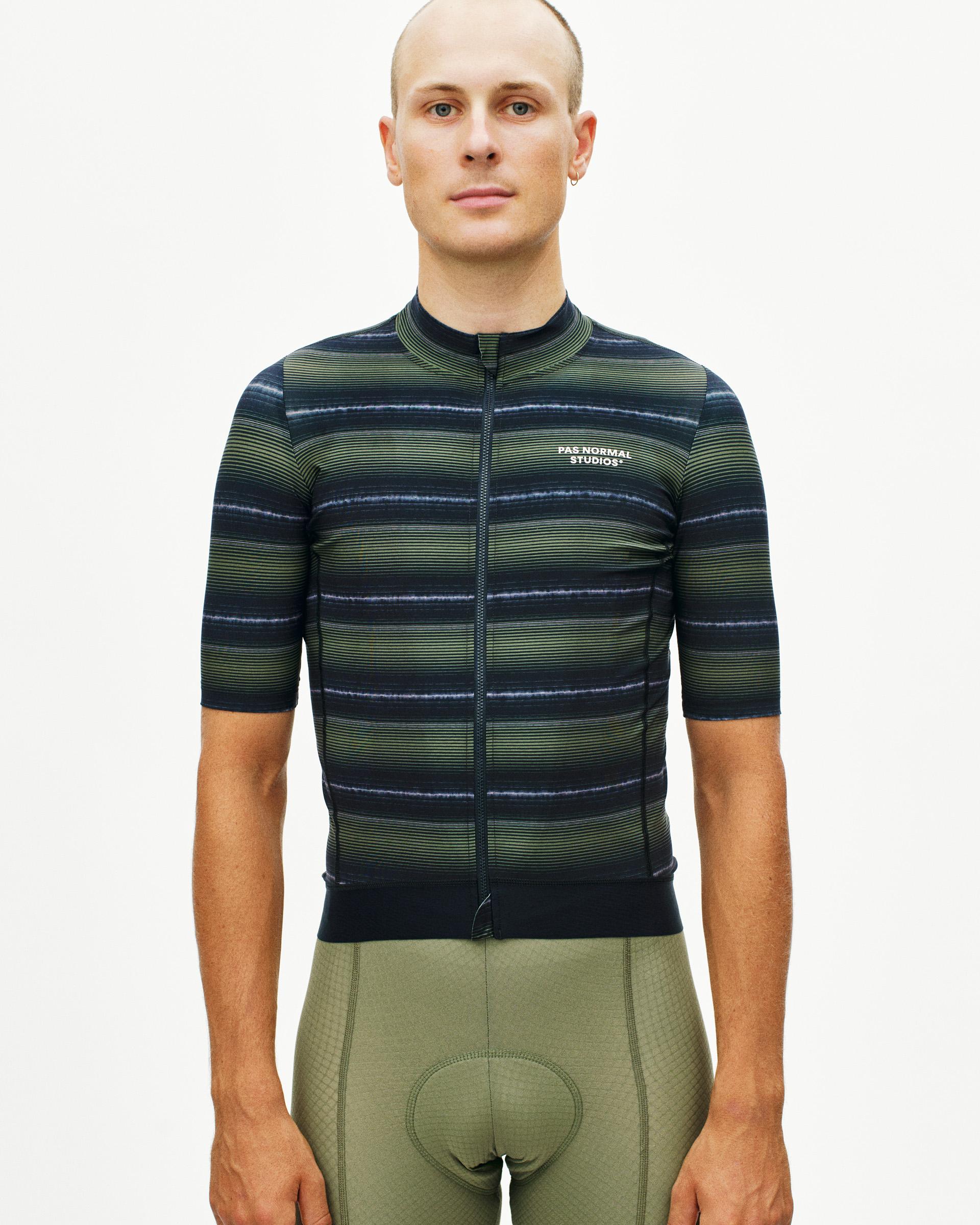 Light Olive Essential cycling jersey on model, front view with horizontal stripe pattern