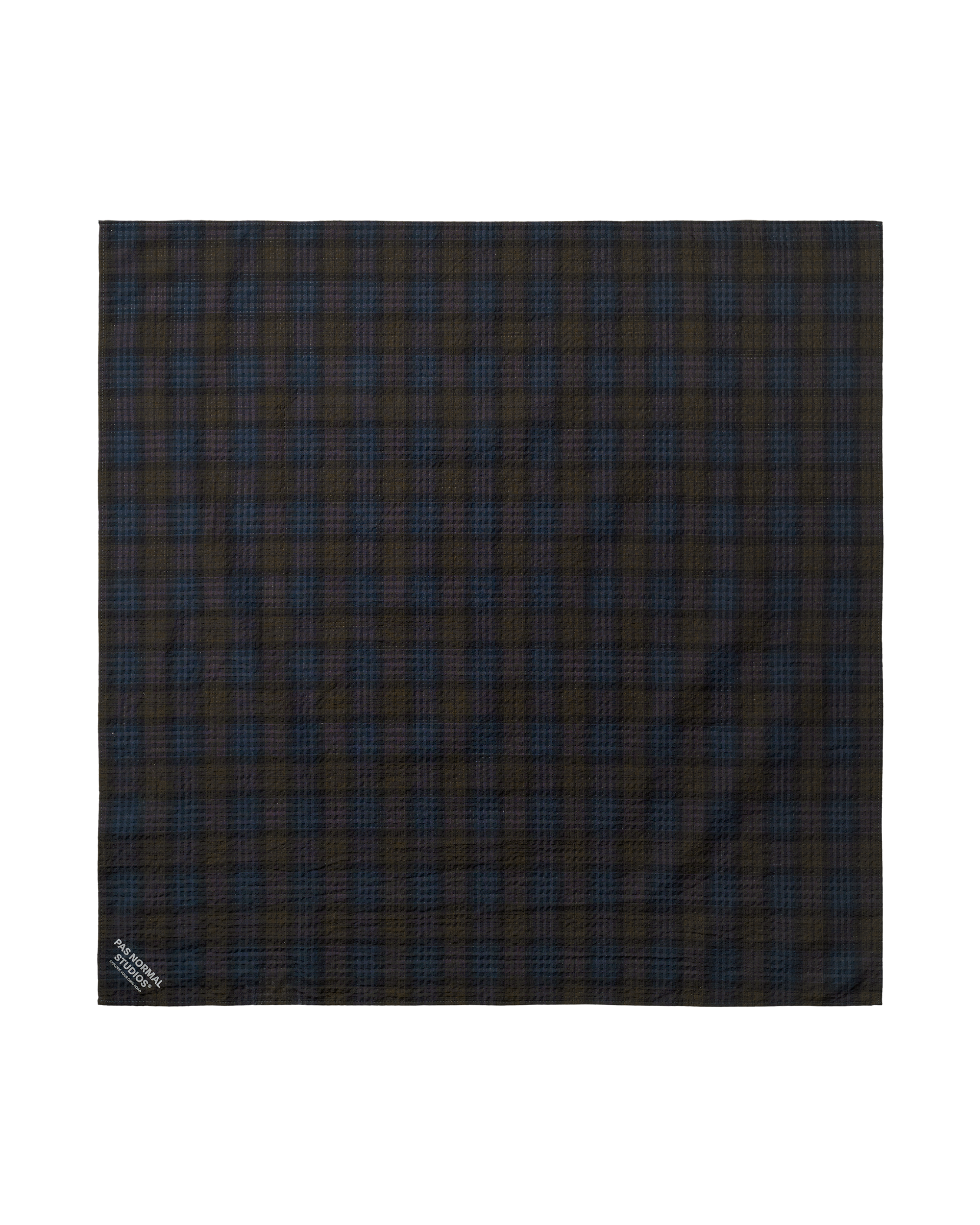 Dark Navy Off-Race Seersucker bandana, flat lay with dark tartan plaid pattern