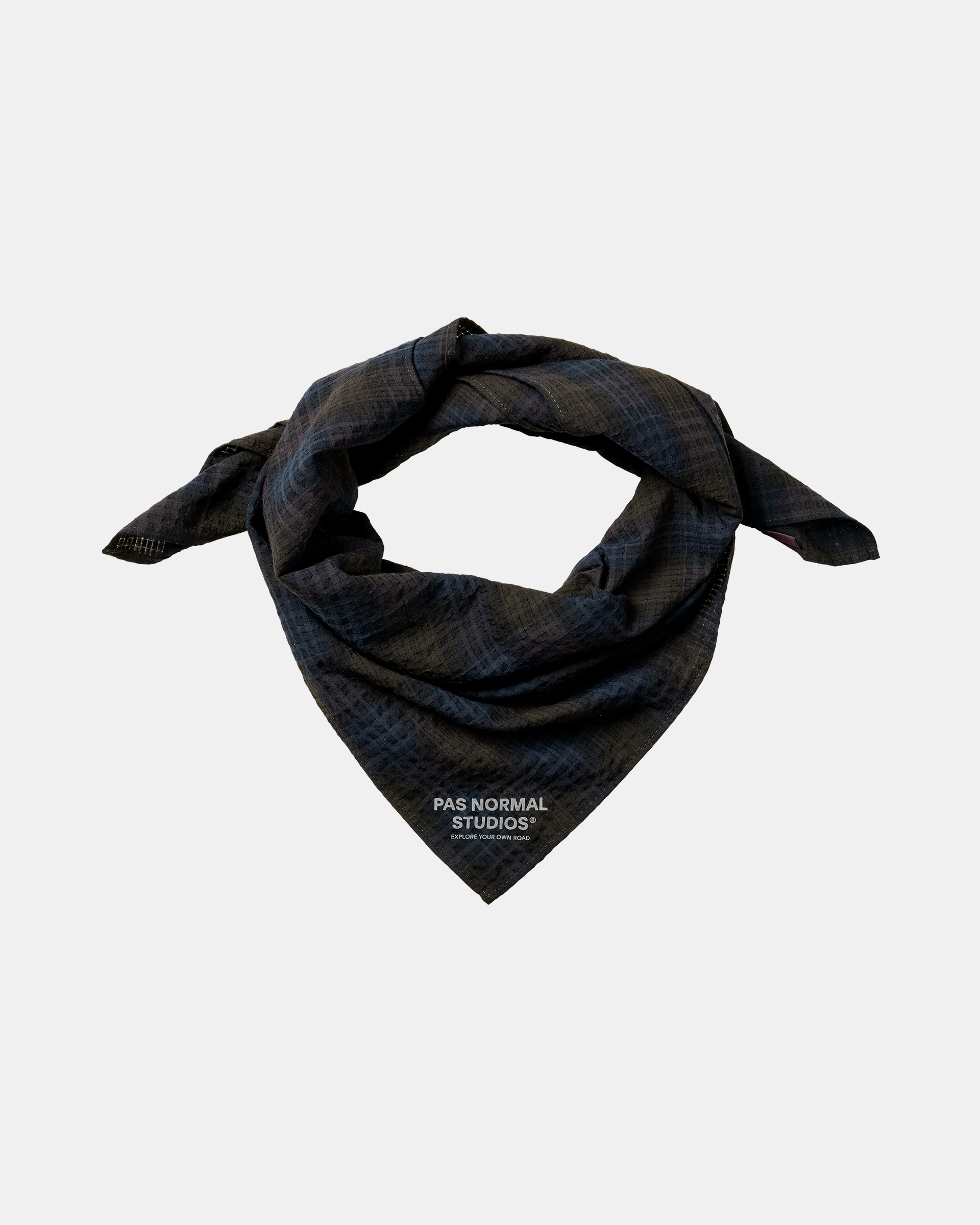 Dark Navy Off-Race Seersucker bandana, folded and twisted showing textured fabric and branded front print