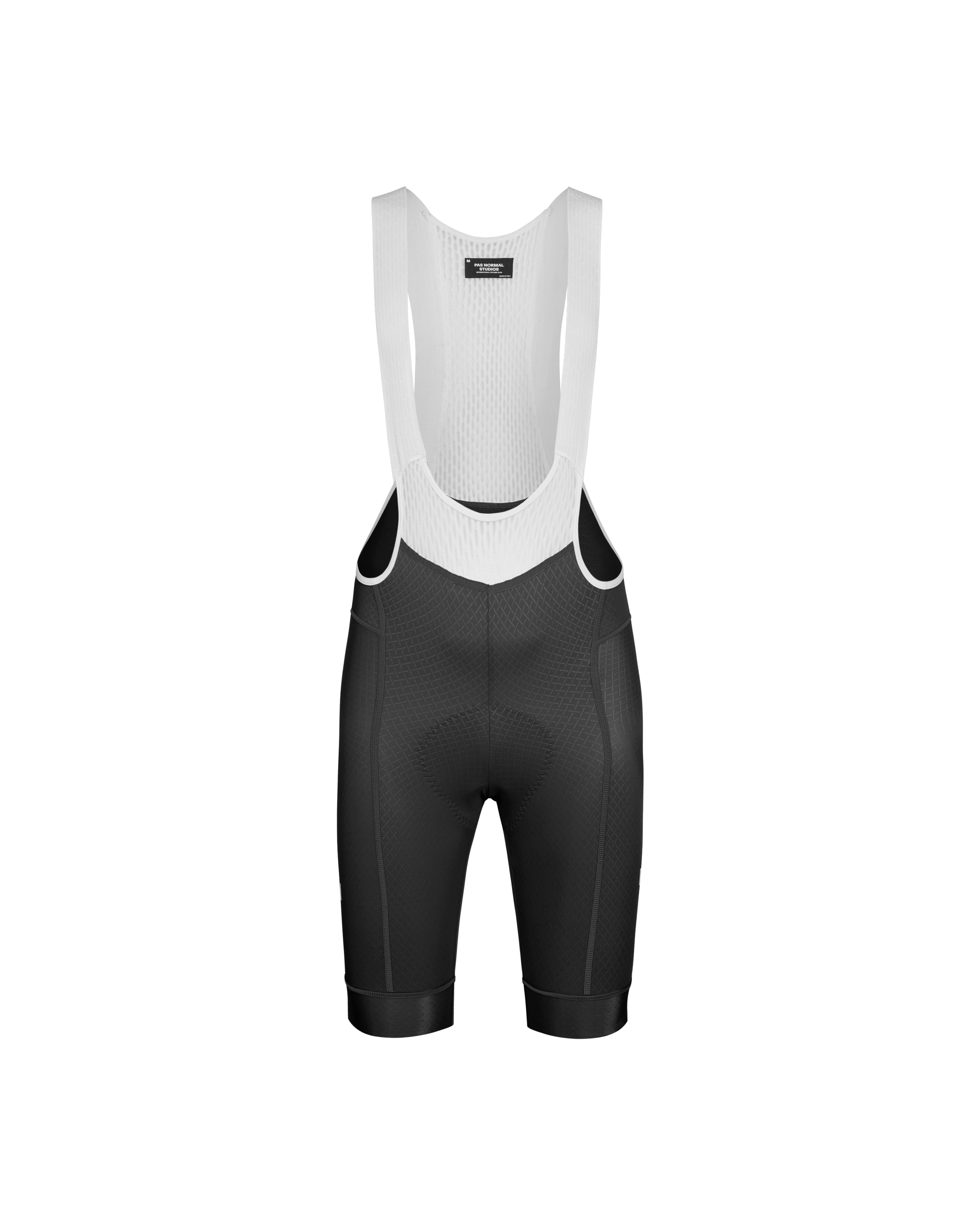 Black Mechanism cycling bibs, front flat lay with white mesh bib straps