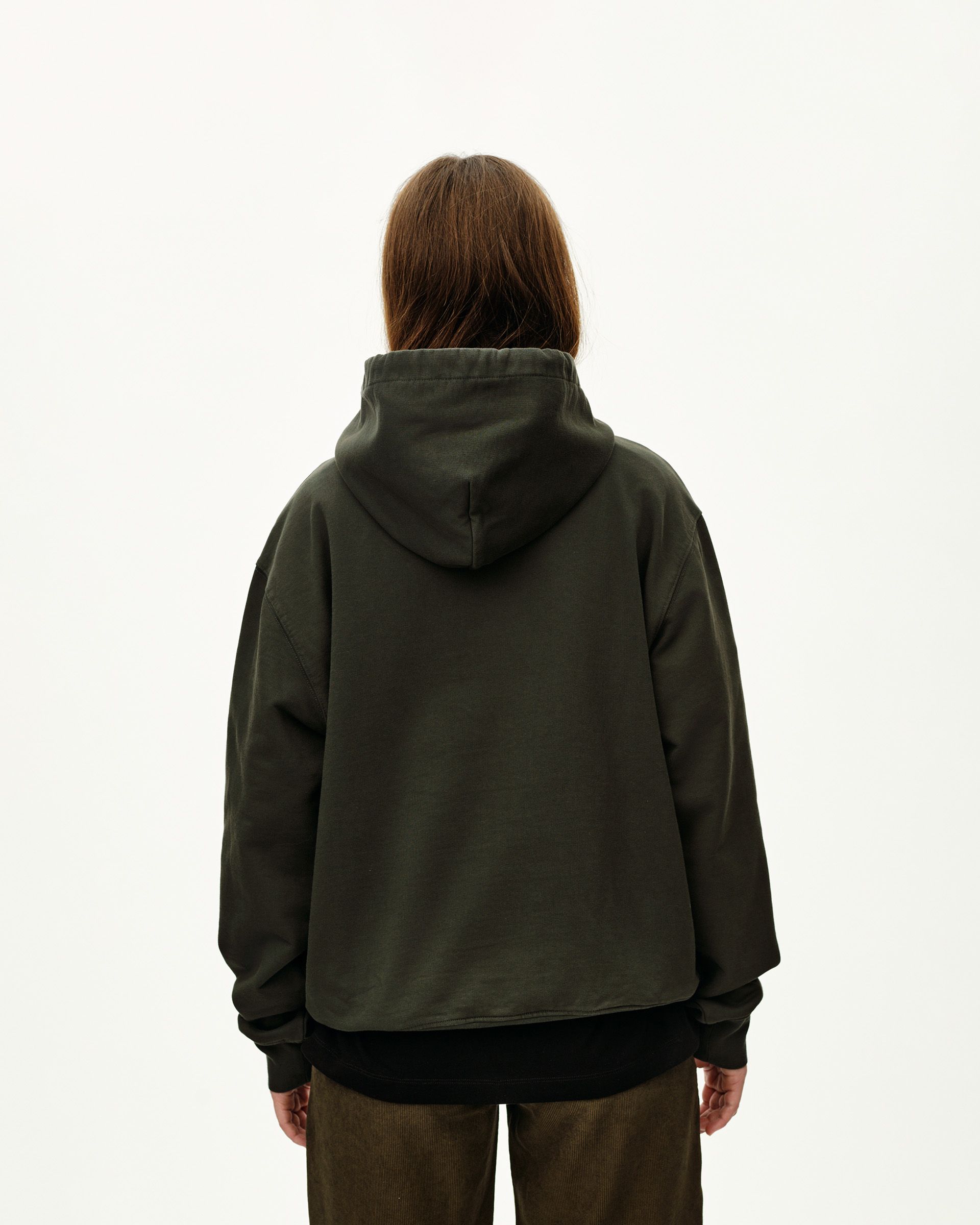 Dark Olive Off-Race hoodie on model, rear view with black ribbed hem