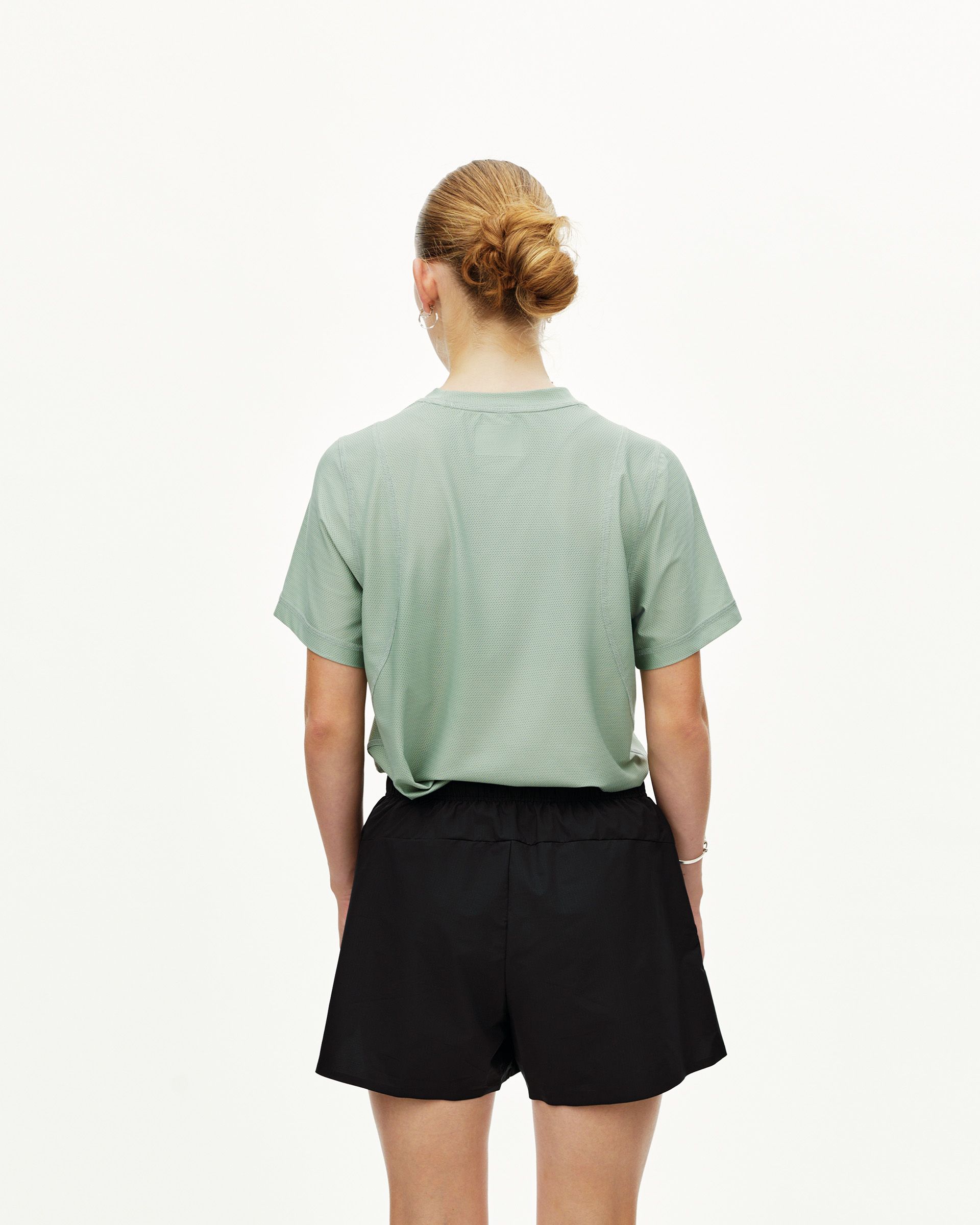 Black Balance shorts on model, rear view with elastic waistband