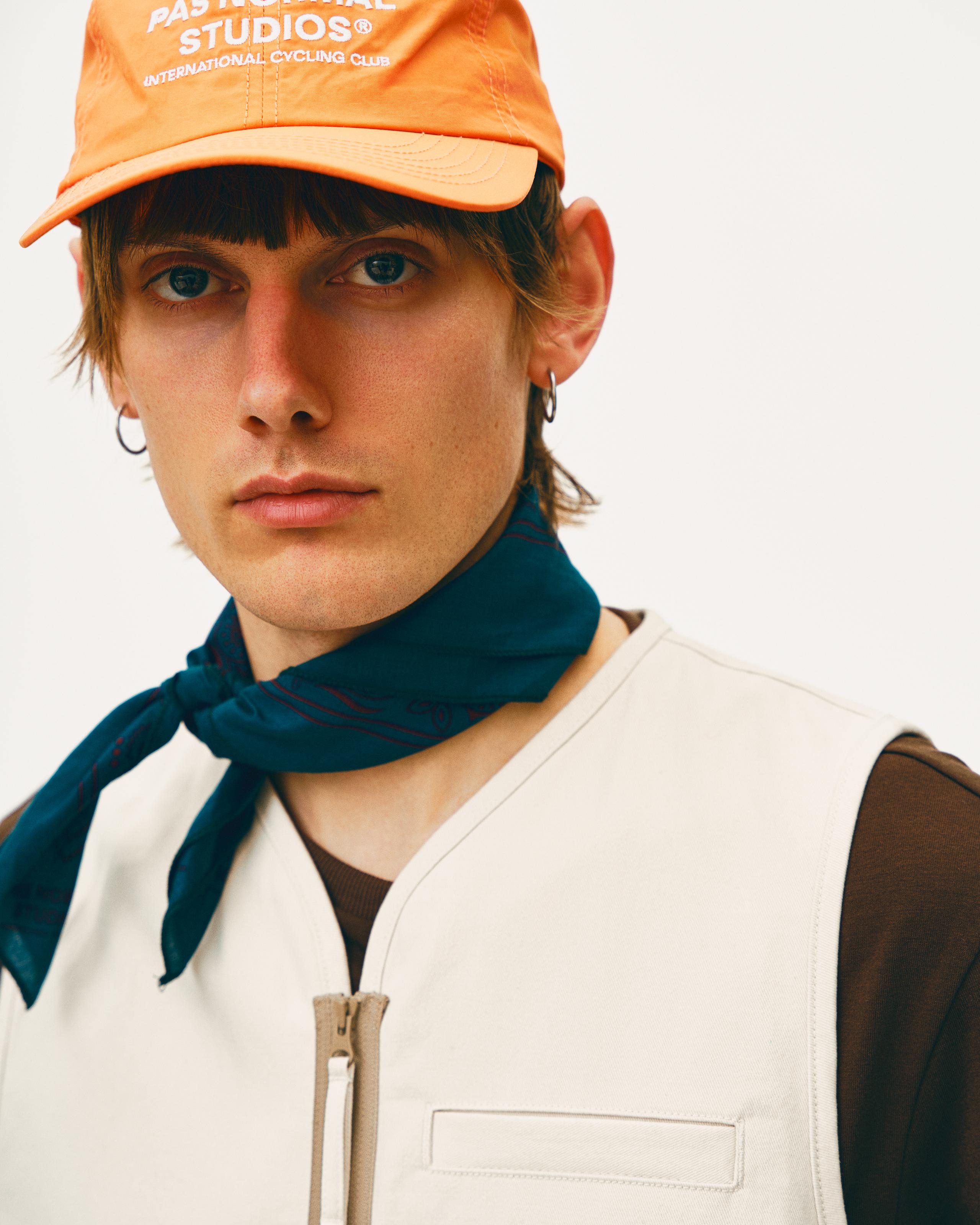 Blue Off-Race bandana on model worn as neck scarf