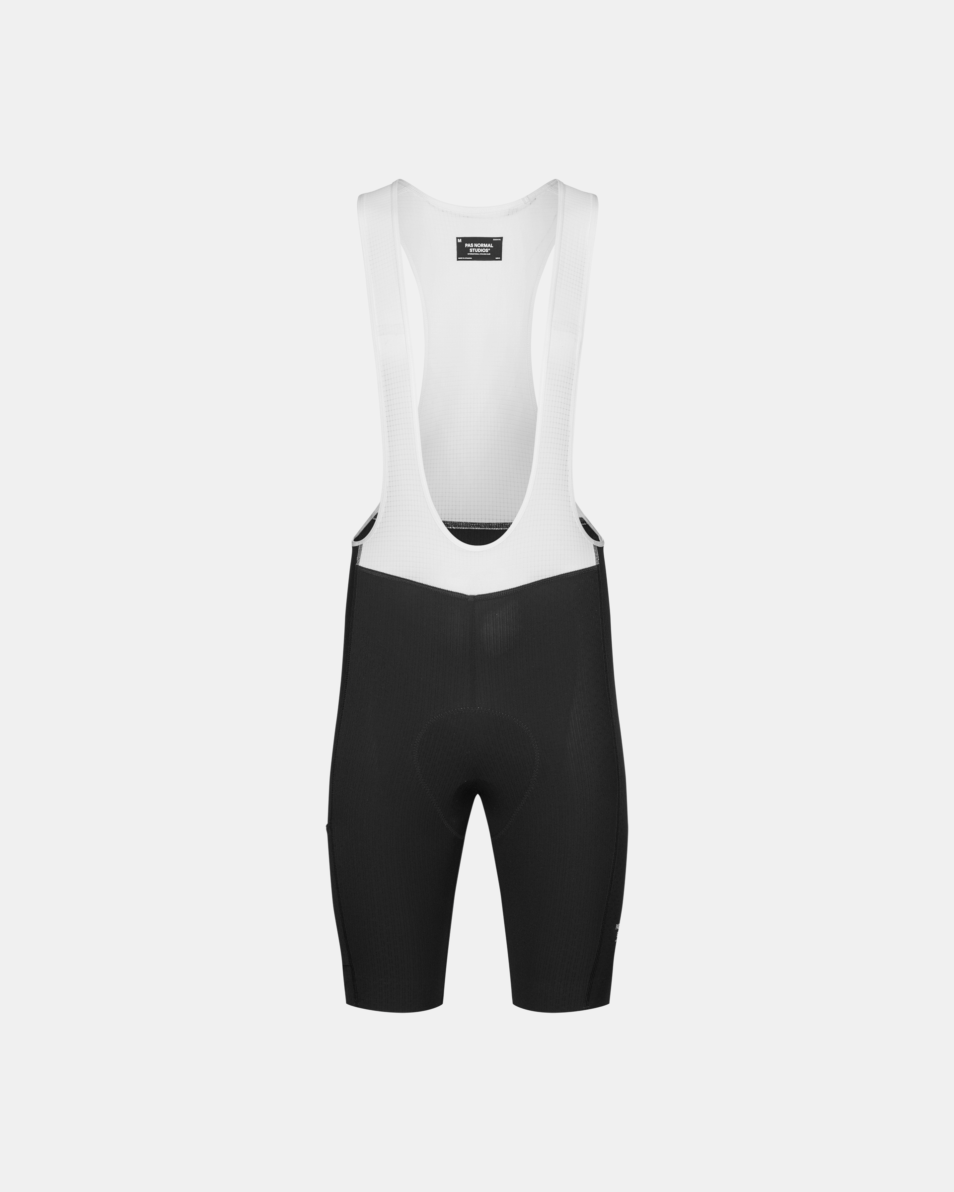 Black Essential Light Cargo cycling bibs, front flat lay with white mesh bib straps