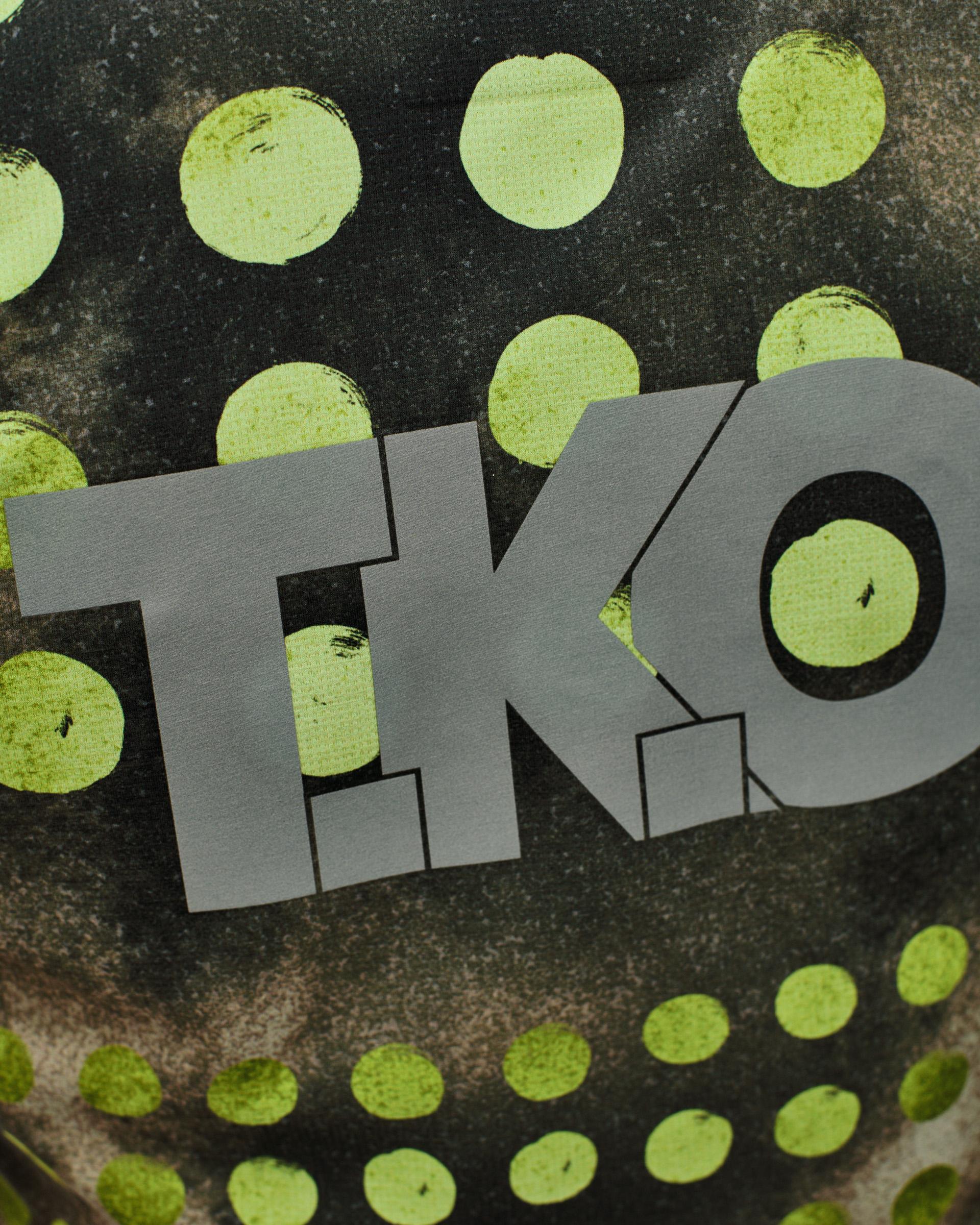 Green T.K.O. Balance singlet, detail view with grey logo on printed fabric