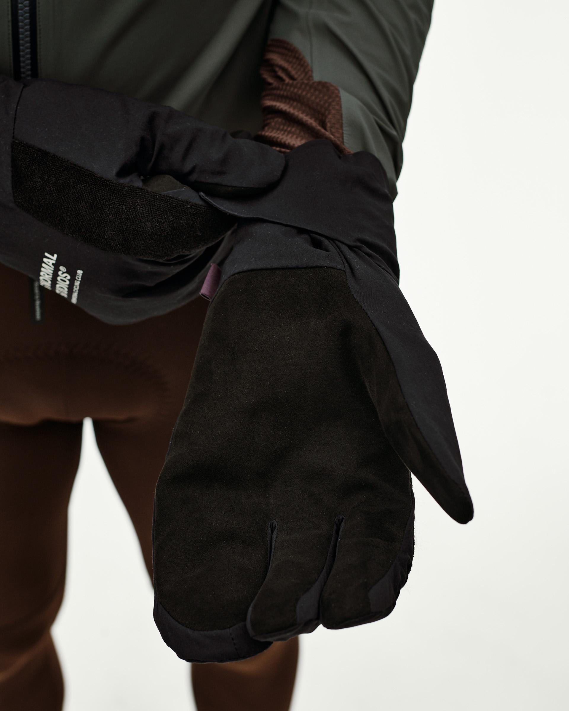 Black Logo Deep Winter Insulated cycling gloves, palm detail on model with suede palm and velcro wrist strap