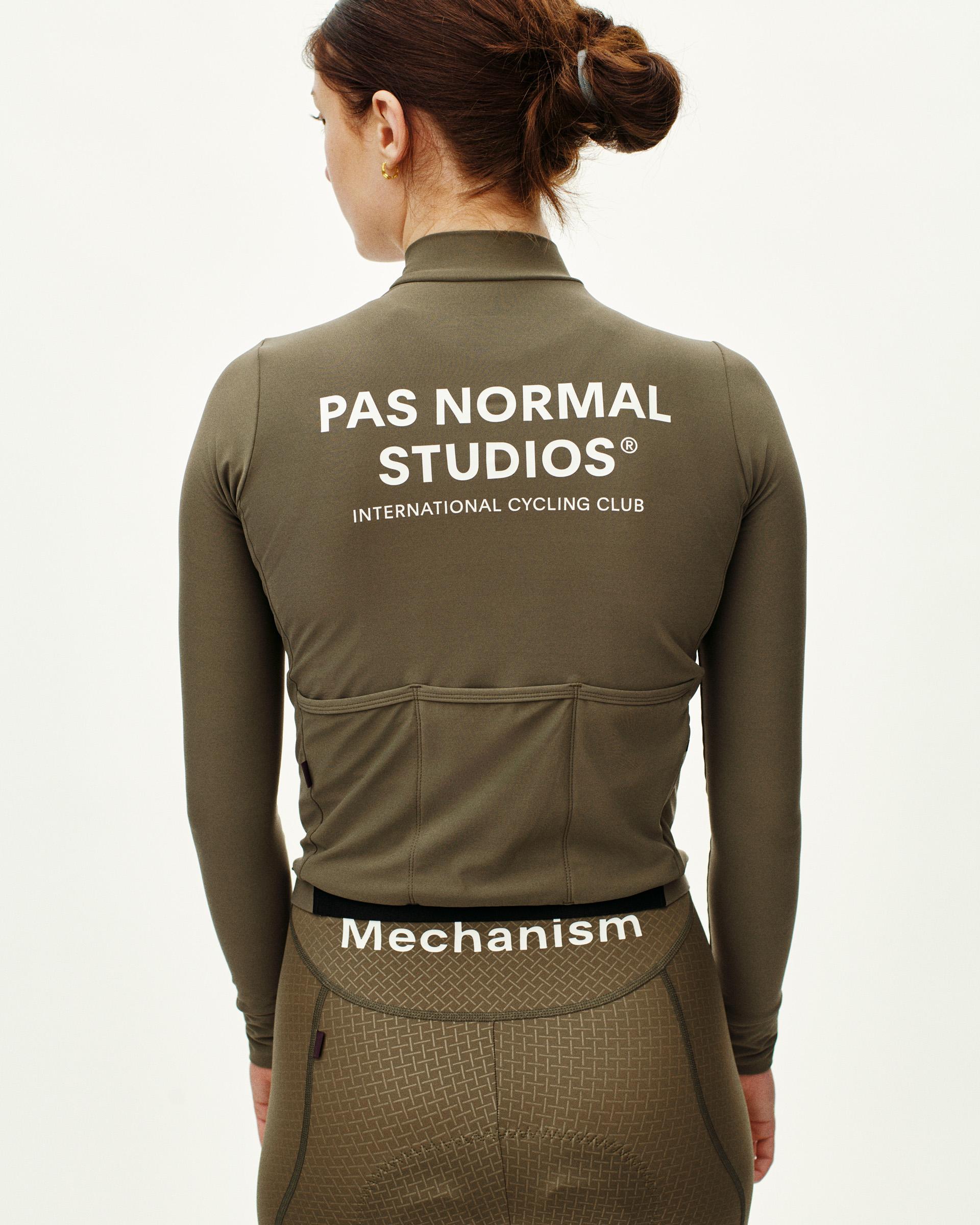 Mud Mechanism long sleeve cycling jersey, rear view on model with white back print