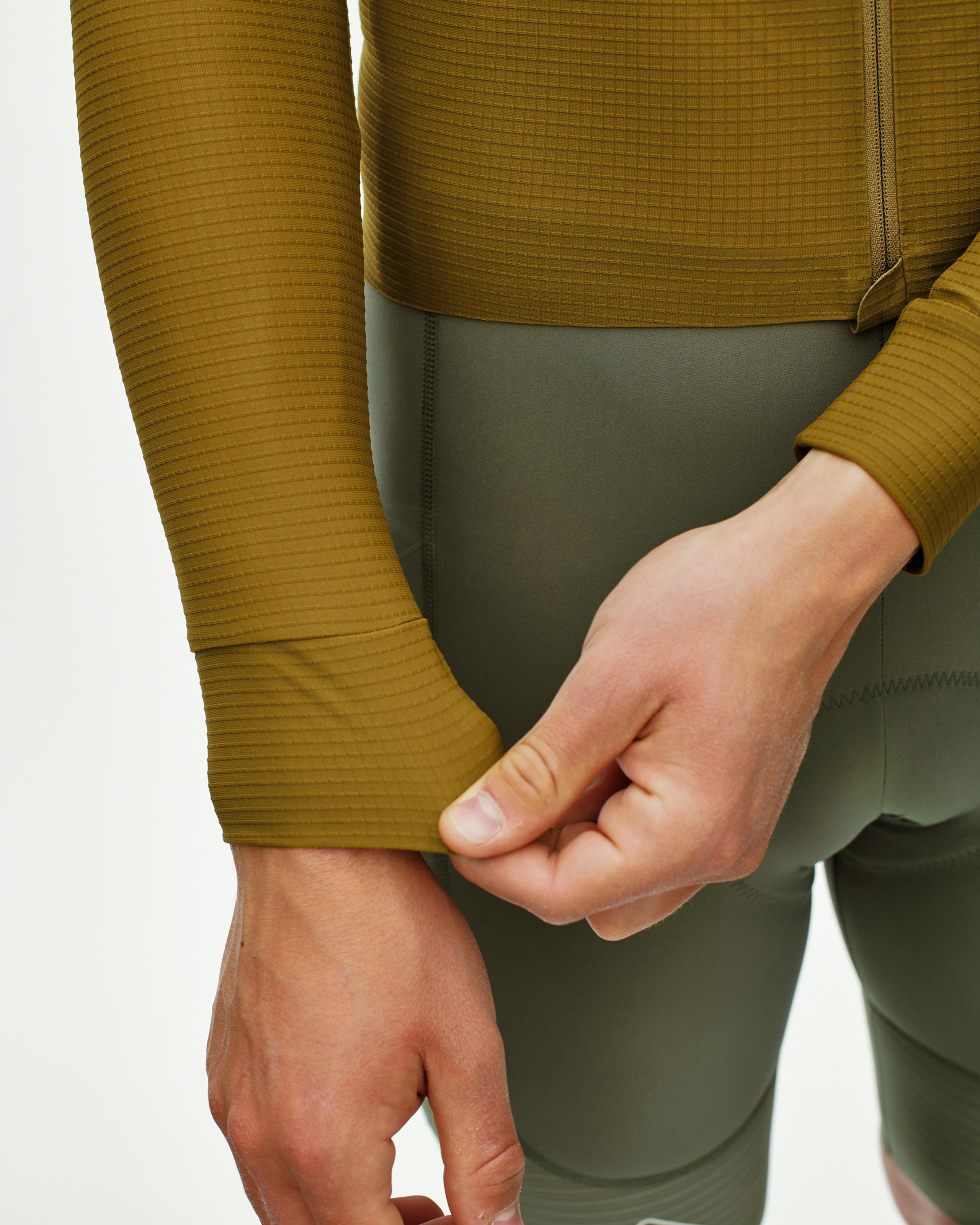 Khaki Green PAS Mechanism Pro long sleeve cycling jersey on model with ribbed texture