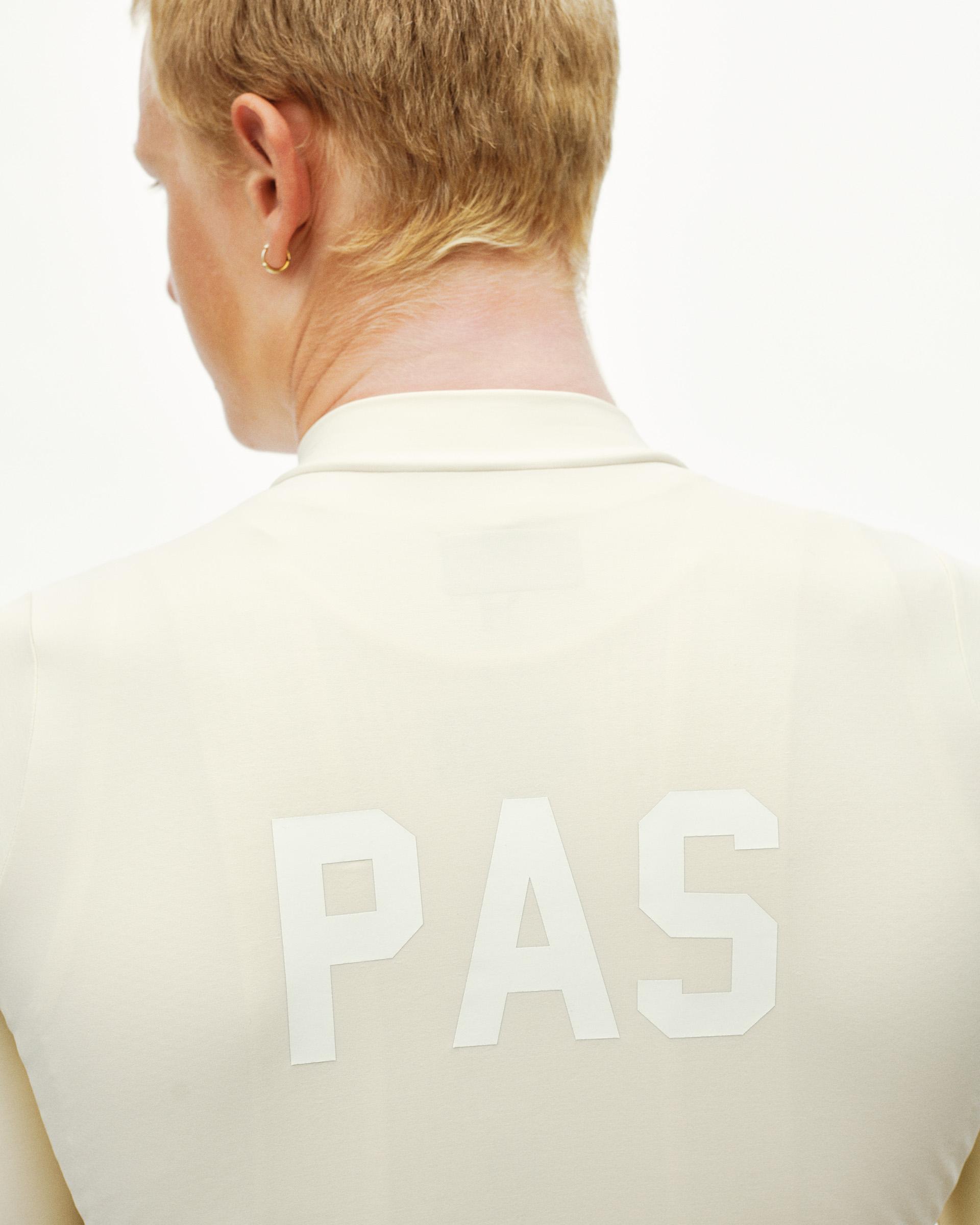 Sand PAS Mechanism long sleeve cycling jersey on model, rear view with tonal PAS back print