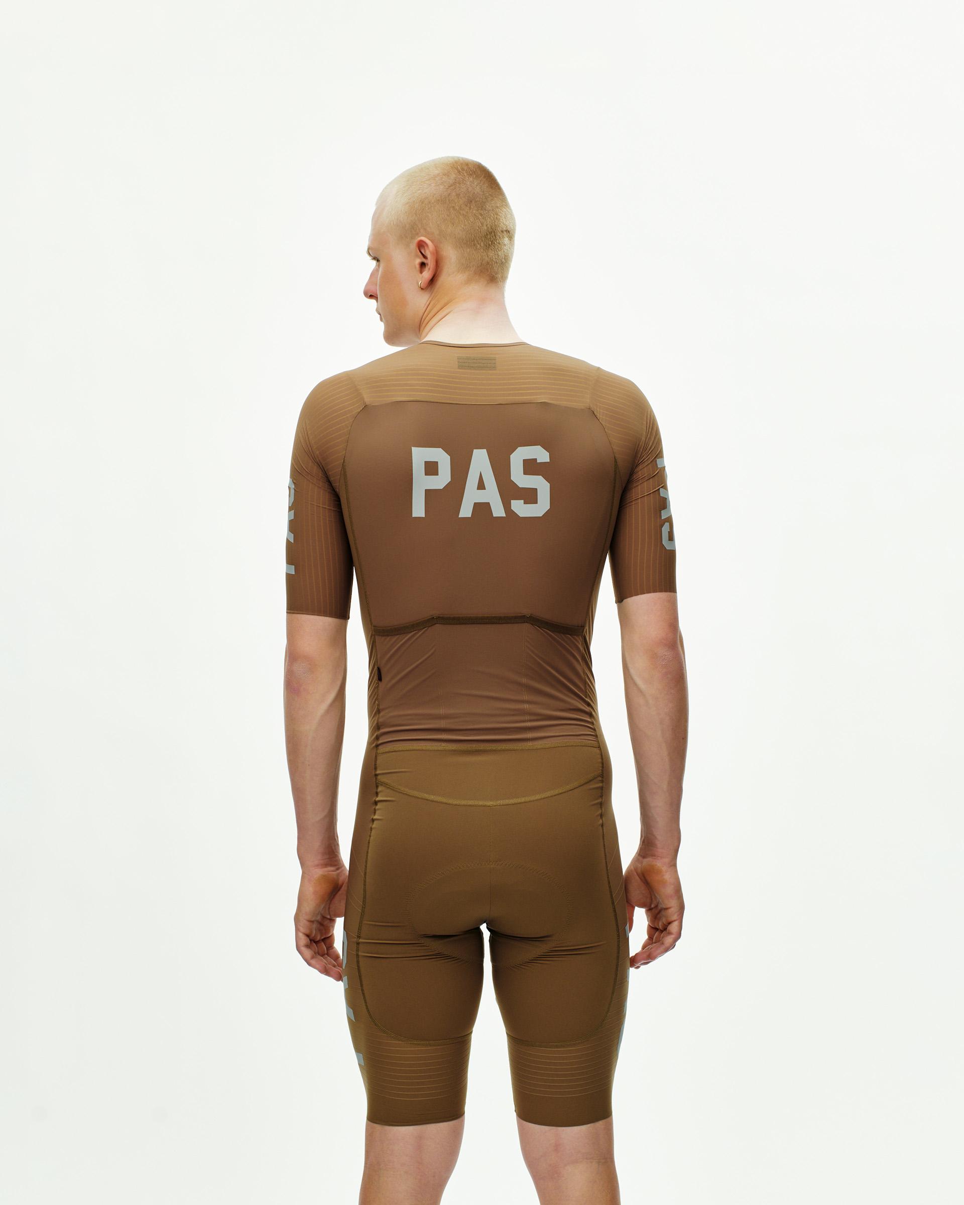 Brown PAS Mechanism Pro speedsuit, rear view on model with white PAS back print