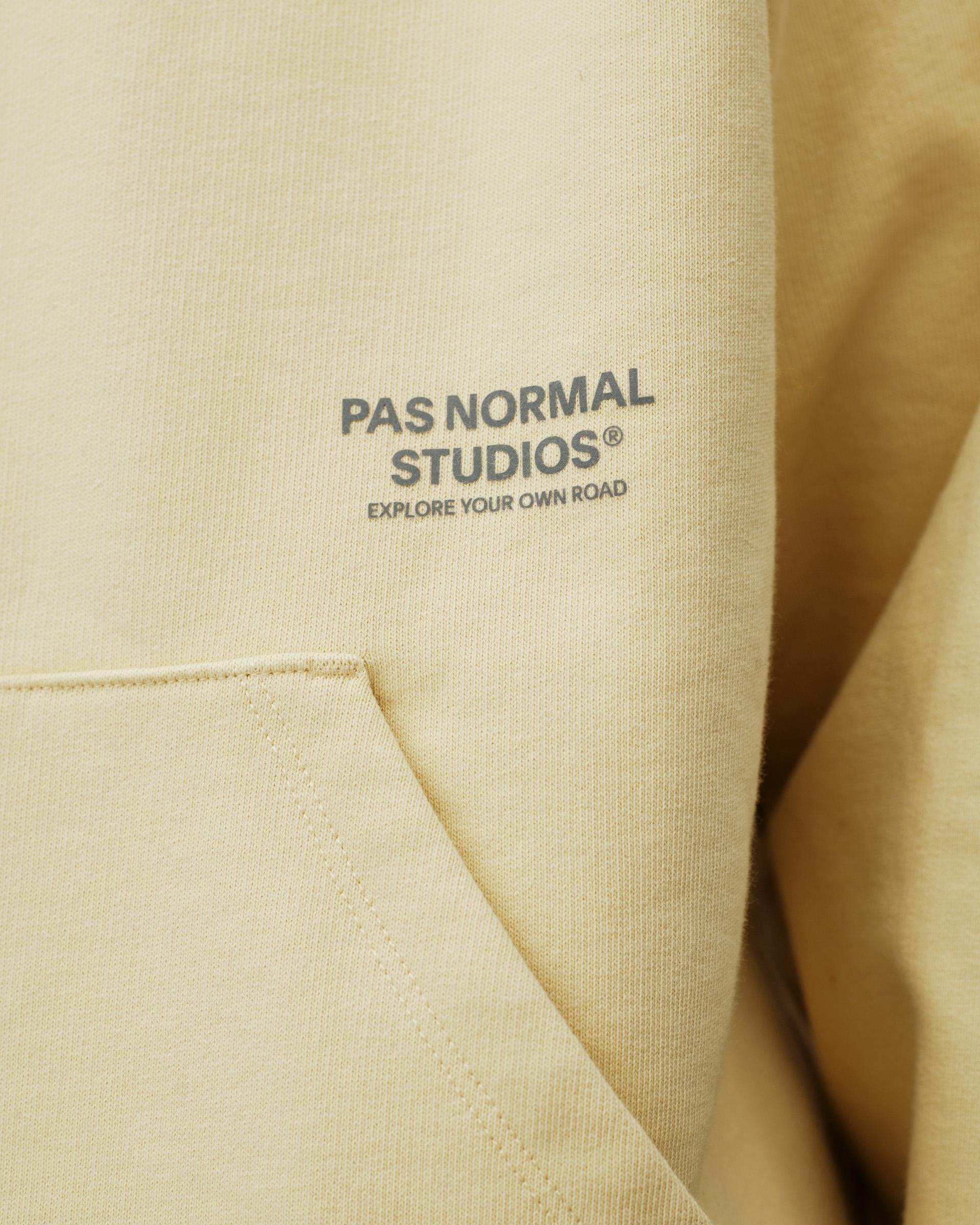 Sand Off-Race hoodie, detail view of chest print and kangaroo pocket