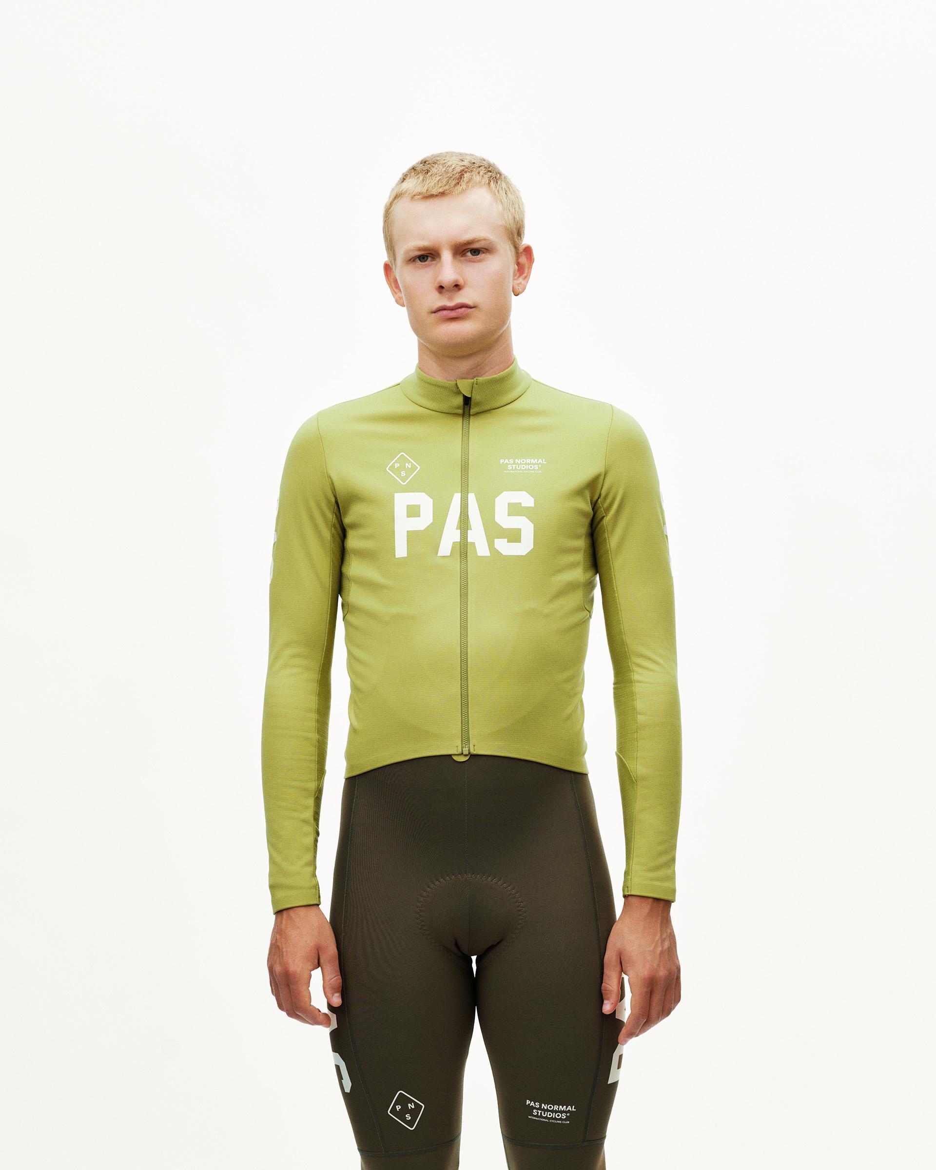 Dark Lime green PAS Mechanism Thermal Long Sleeve cycling jersey on model, front view with white chest print