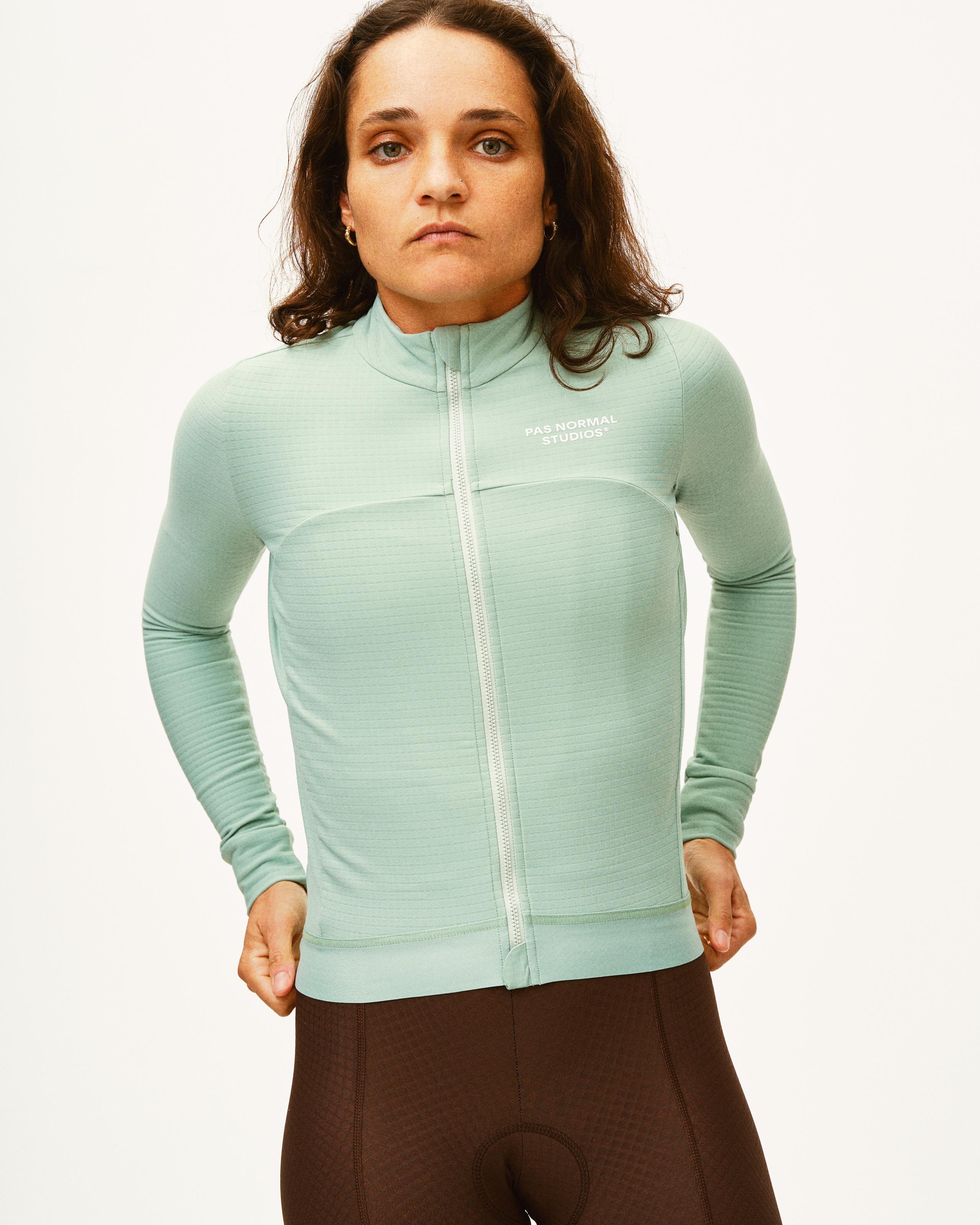 Celeste Essential long sleeve cycling jersey on model with white chest logo and full zip