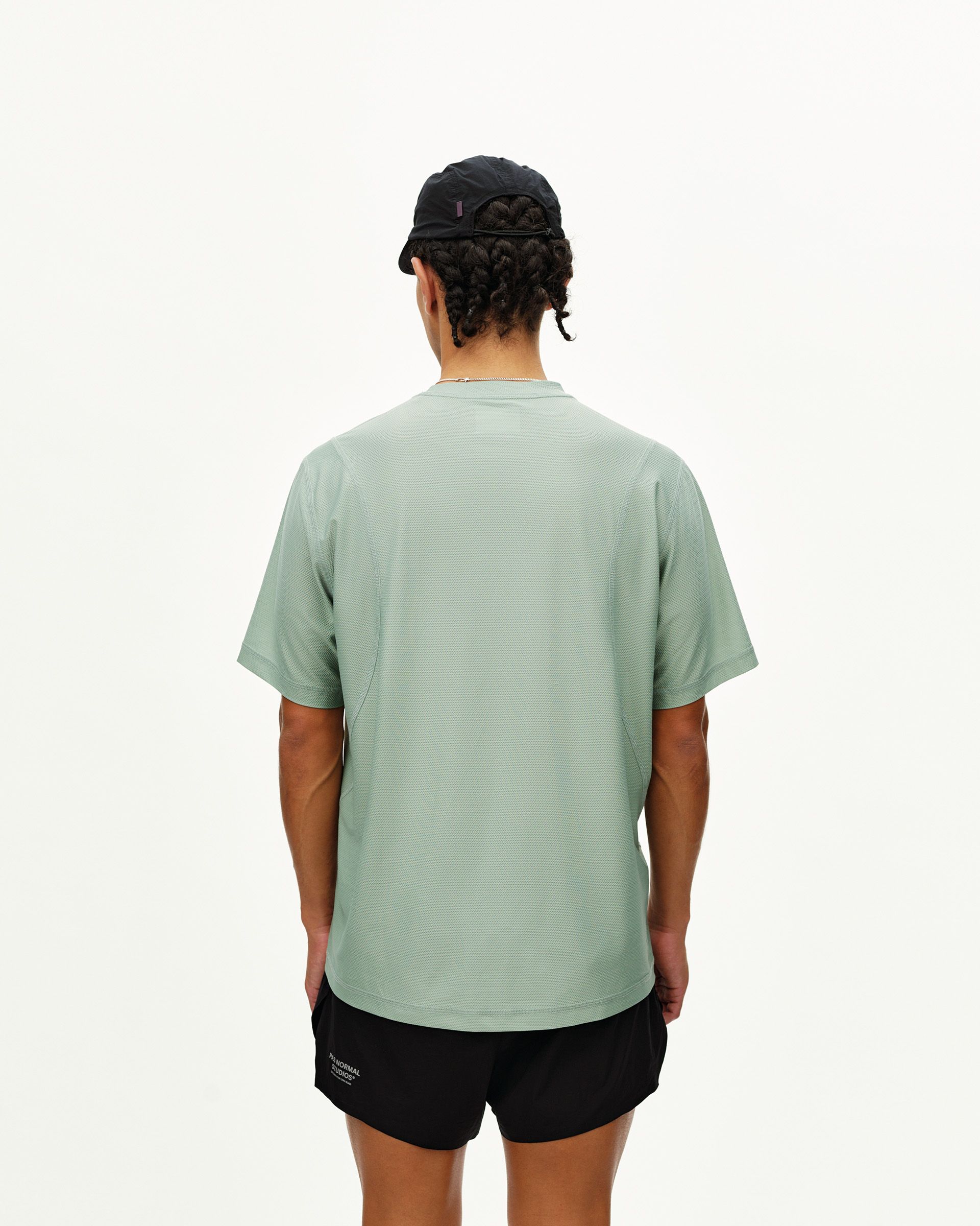 Green Sage Balance T-Shirt, rear view on model with textured mesh fabric