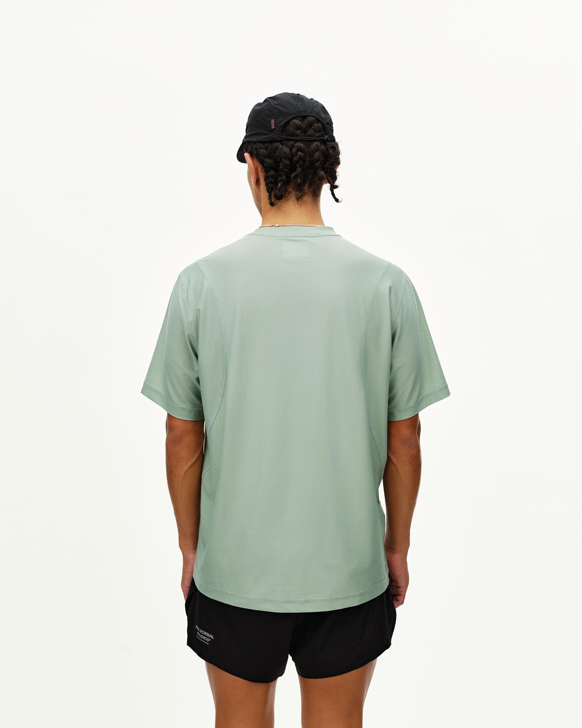Green Sage Balance T-Shirt, rear view on model with textured mesh fabric
