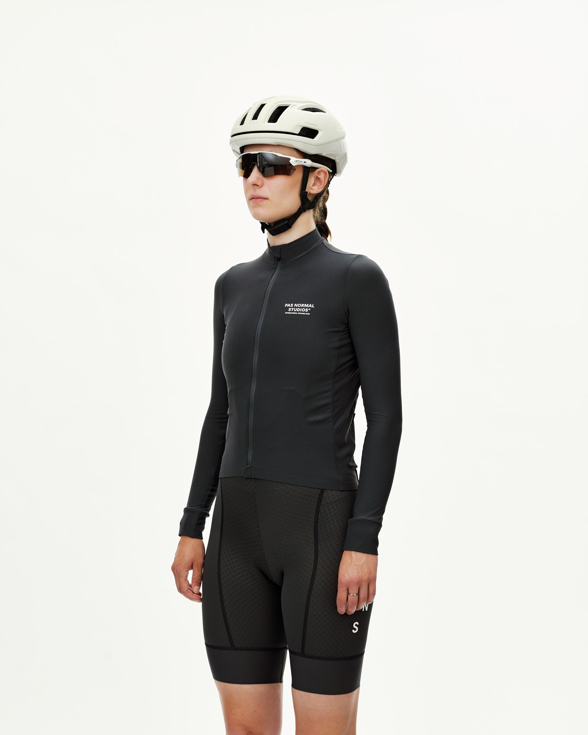 Dark Navy Mechanism women's long sleeve cycling jersey, front view on model with white chest logo print
