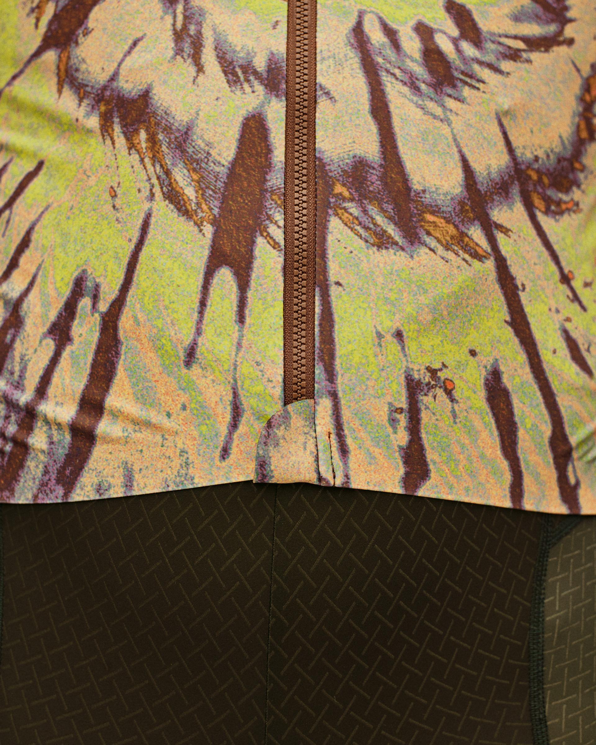 Beige STFR Mechanism long sleeve cycling jersey, detail view showing brown zip and abstract print