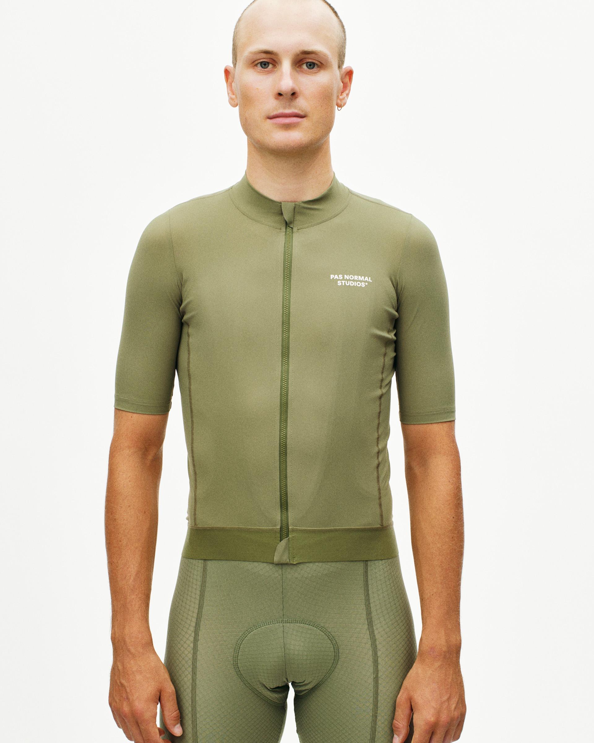 Light Olive Essential cycling jersey on model with full zip and white chest logo