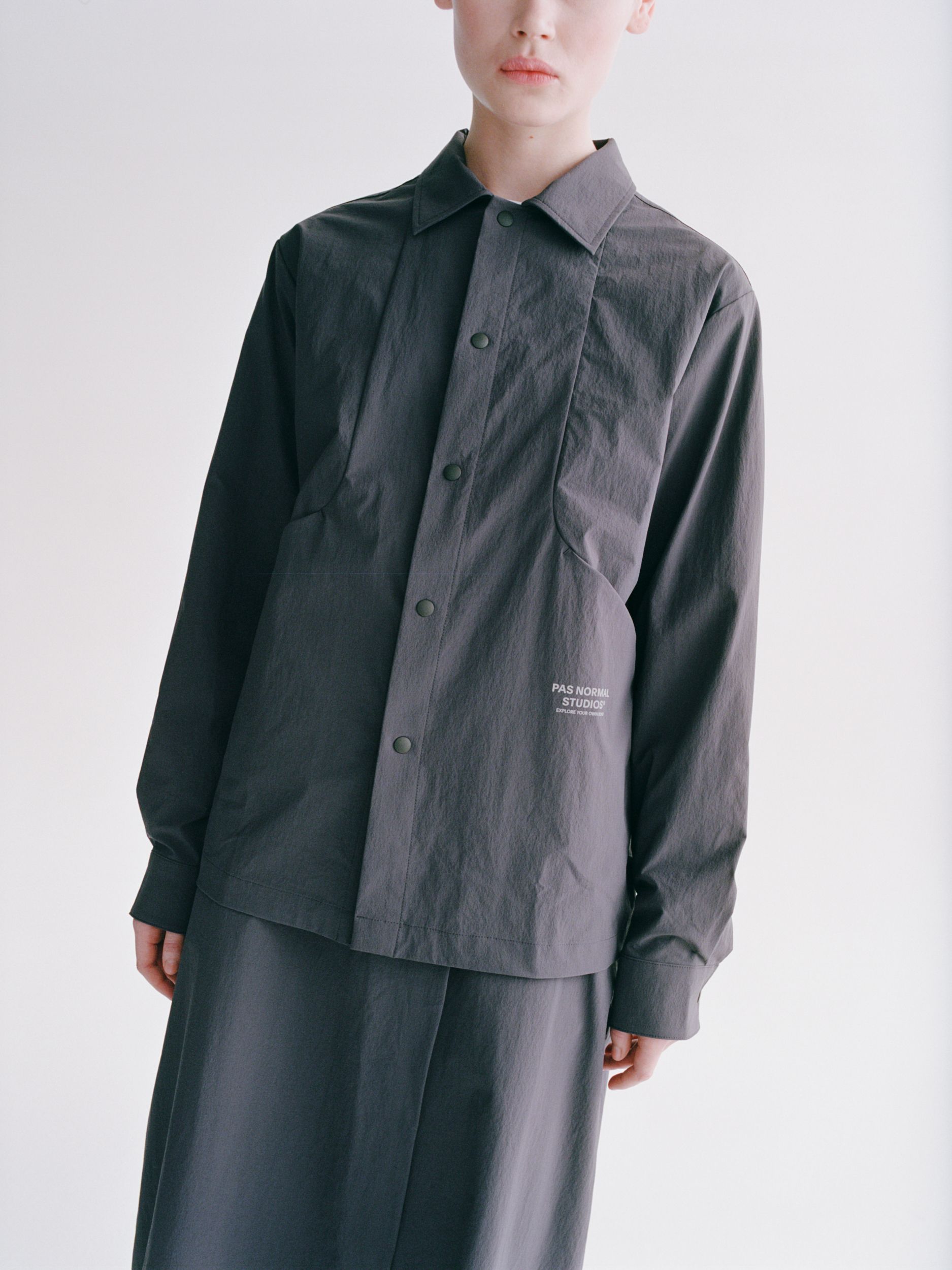 Steel Off-Race Tech Overshirt on model with button front and white chest logo