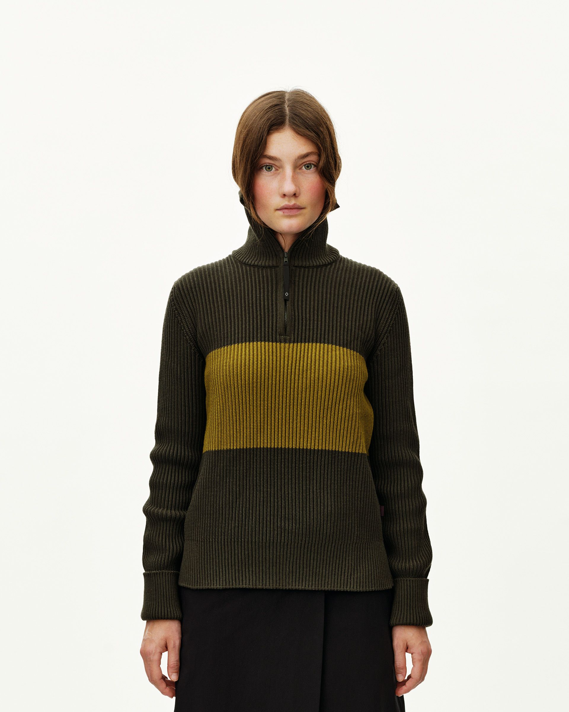 Olive Off-Race Merino Knit Half-Zip sweater on model, front view with yellow contrast panel