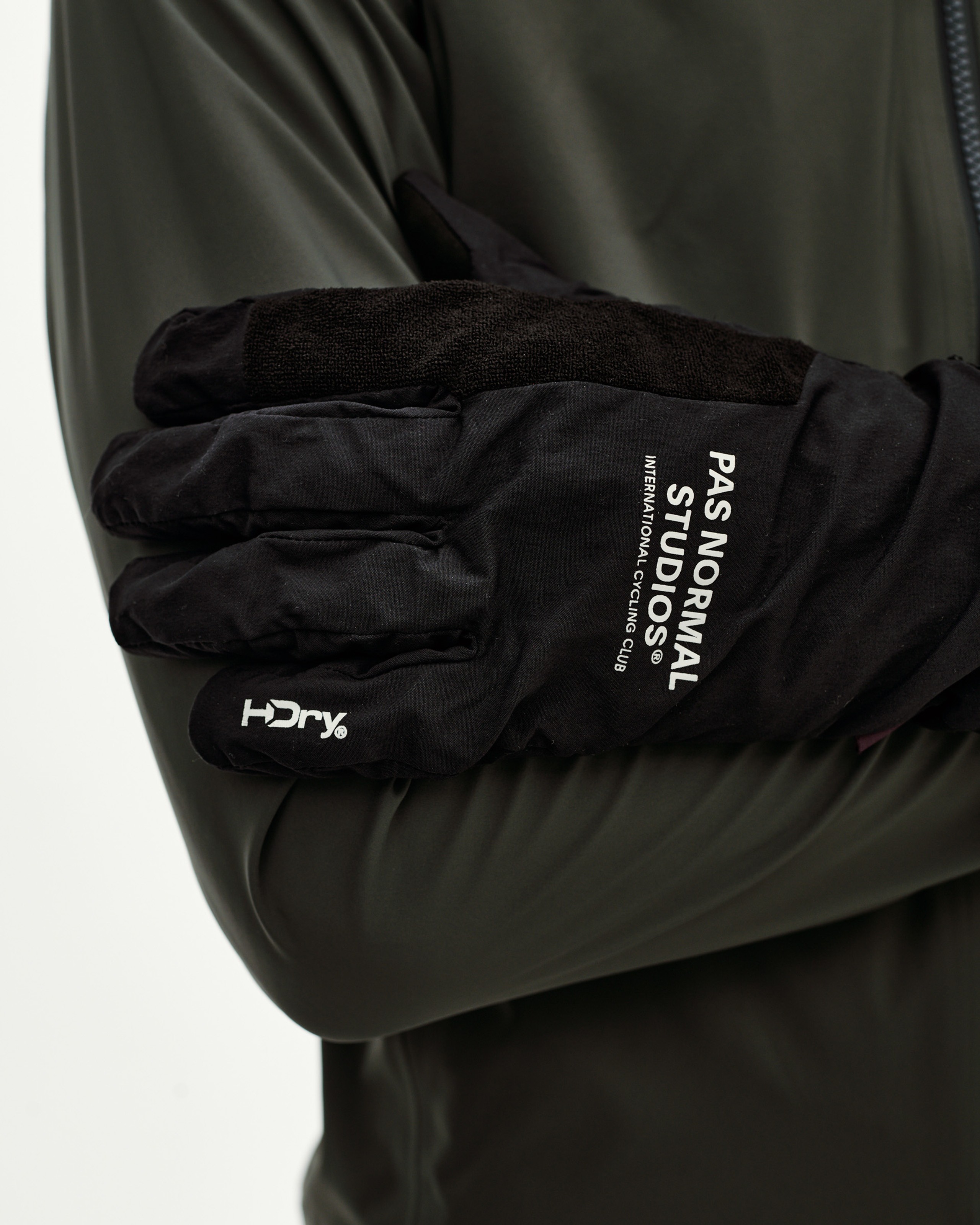 Black Logo Mid cycling glove, detail on model with white brand print and H-Dry logo on cuff