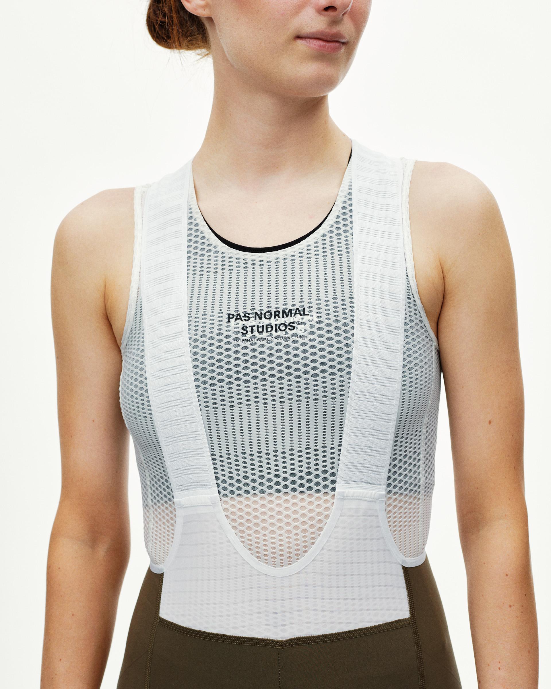 Dark Earth PAS Mechanism Pro cycling bibs on model, front view with white mesh bib panel and chest print