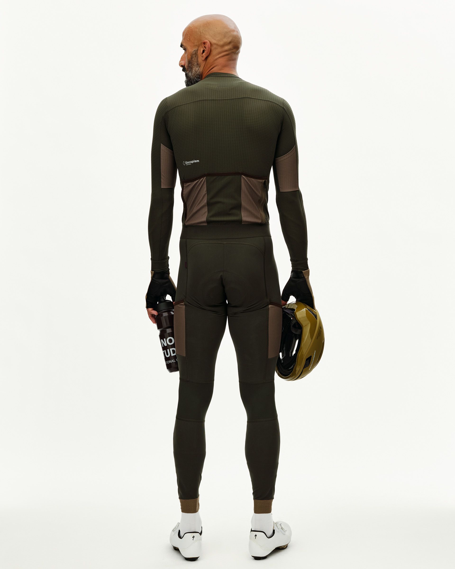 Dark Olive Escapism long sleeve cycling jersey on model, rear view with contrast brown back pockets and textured panels
