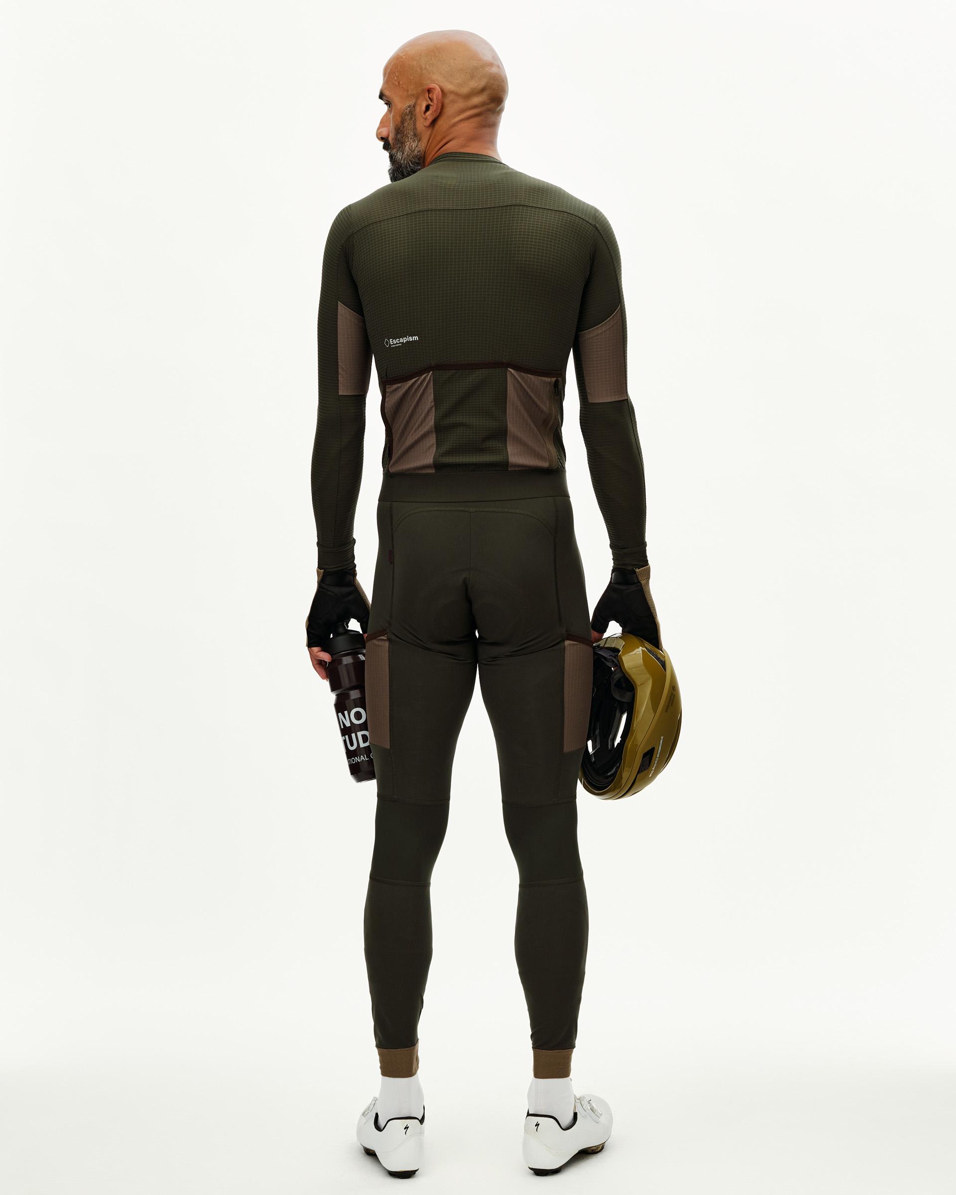 Dark Olive Escapism long sleeve cycling jersey on model, rear view with contrast brown back pockets and textured panels