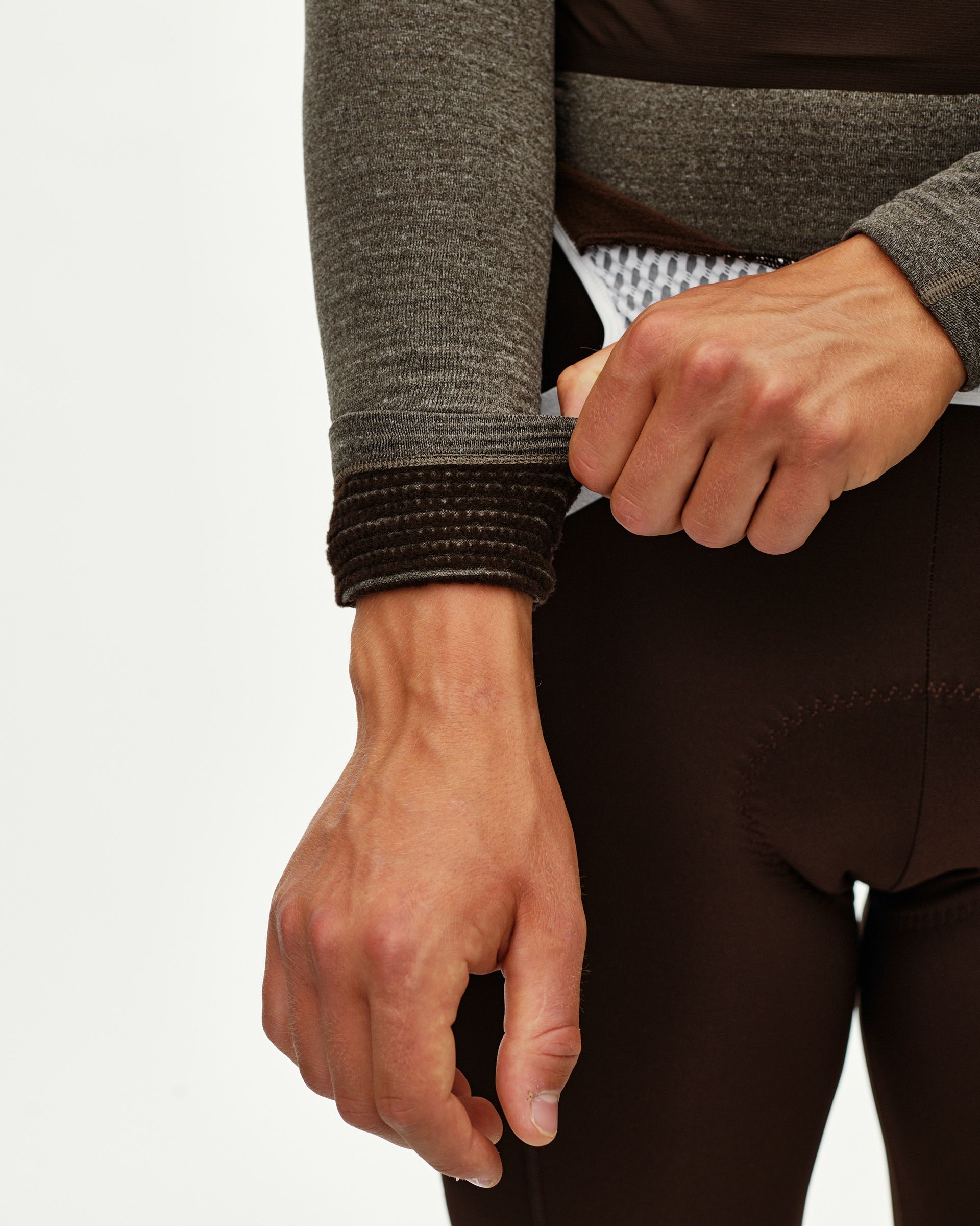 Dark Coffee brown Thermal Hooded Windproof cycling base layer, detail on model showing ribbed cuff on sleeve
