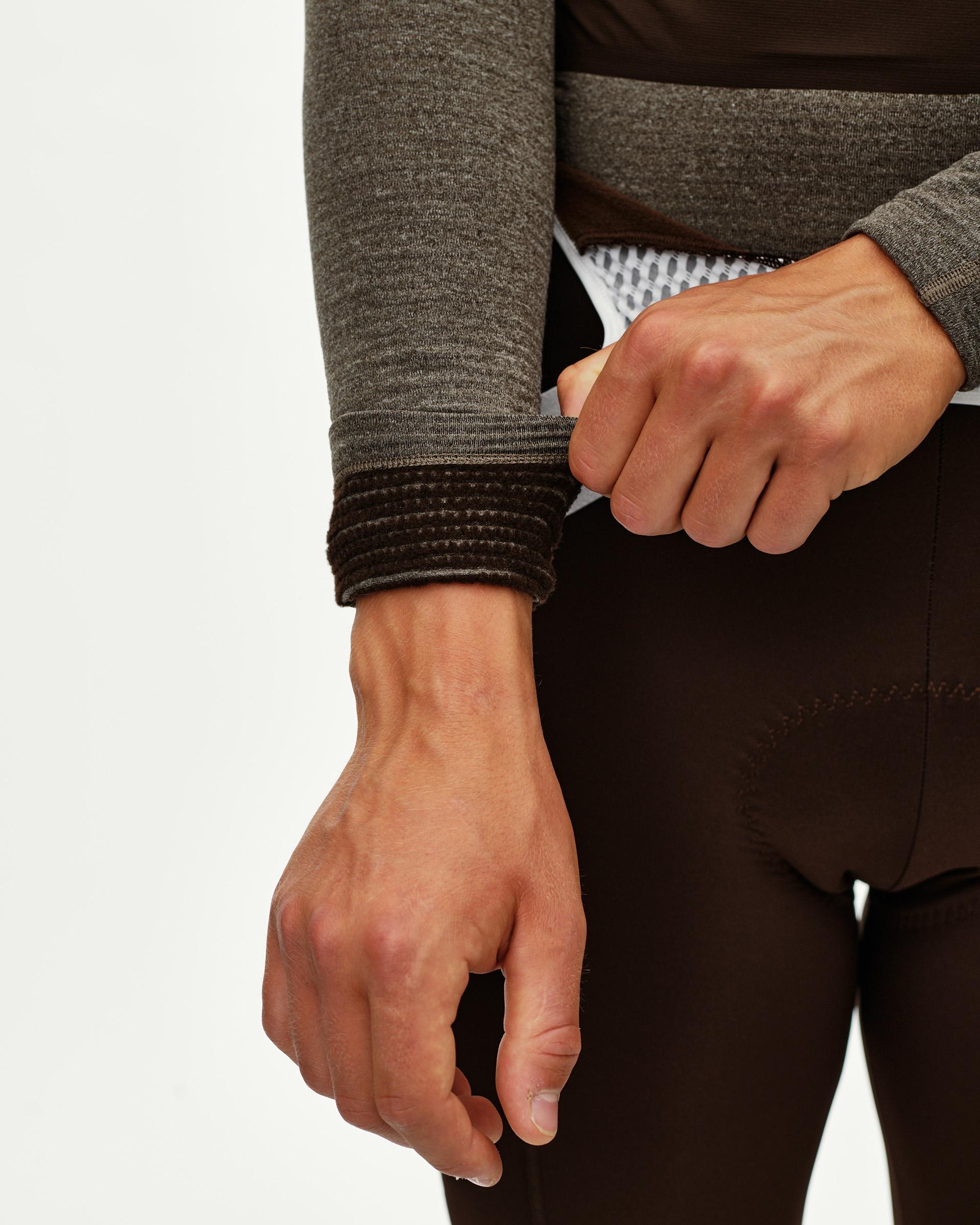Dark Coffee brown Thermal Hooded Windproof cycling base layer, detail on model showing ribbed cuff on sleeve