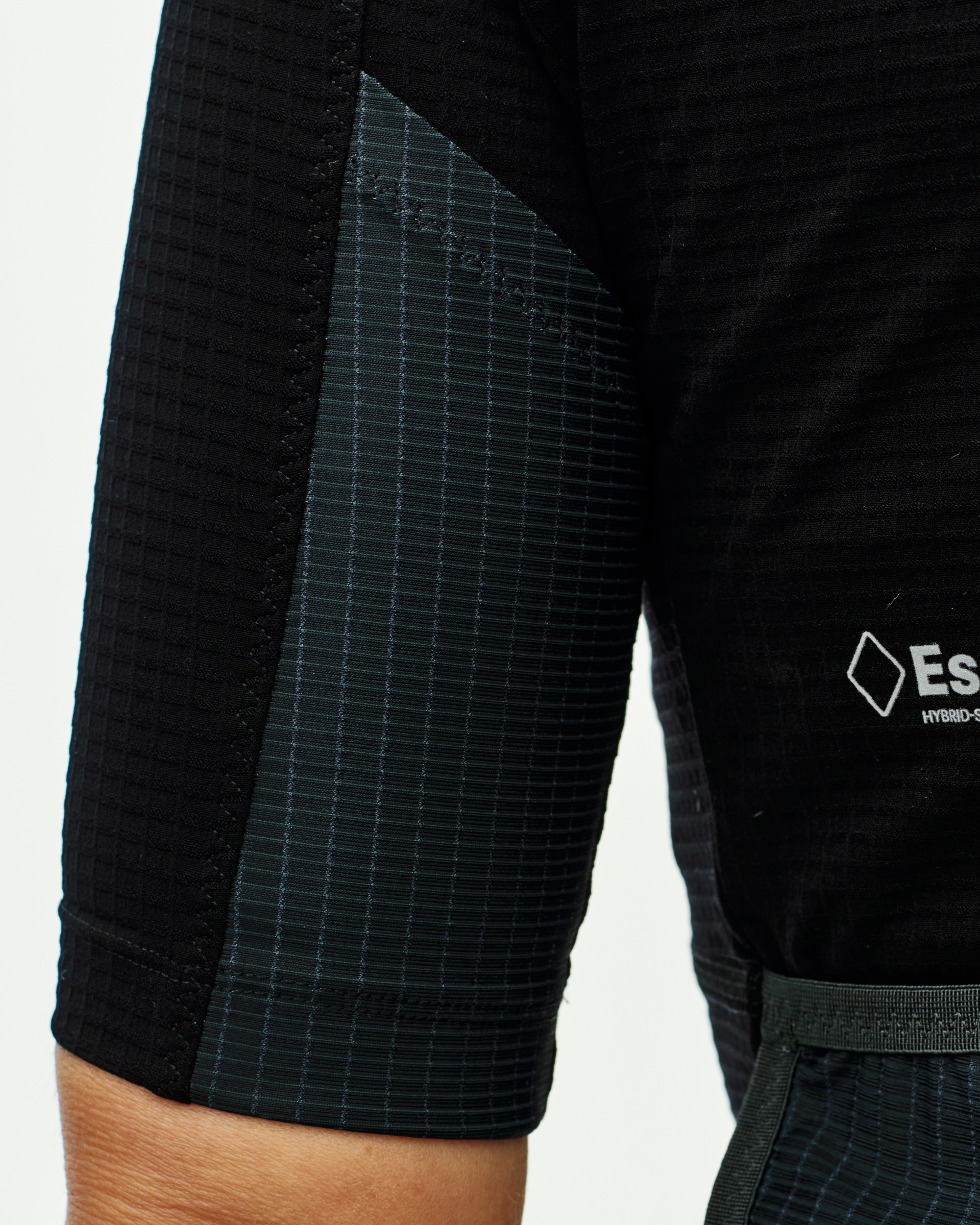 Rear arm panel with textured fabric construction for additional storage pocket