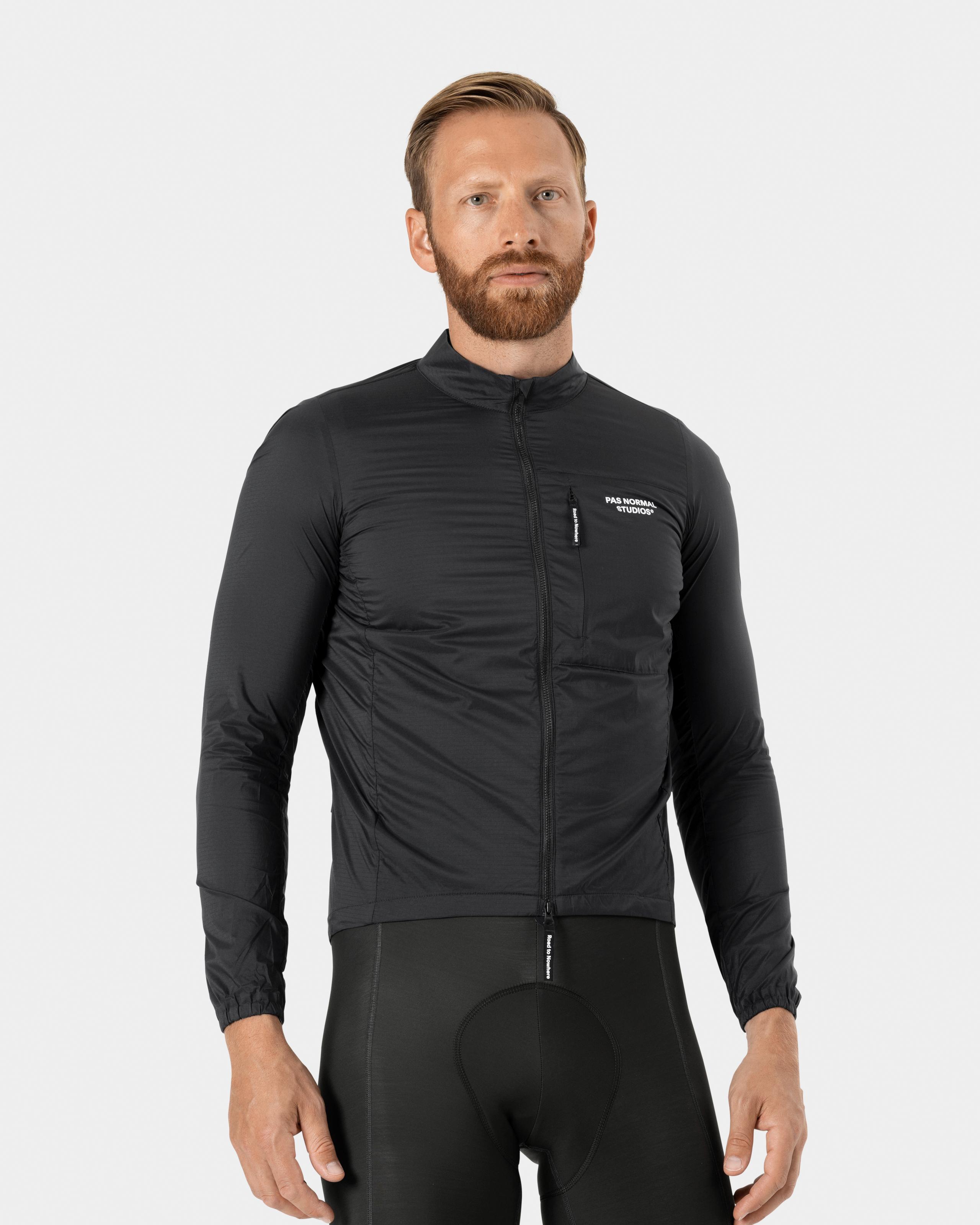 Black Essential Insulated cycling jacket on model, front view with white chest logo