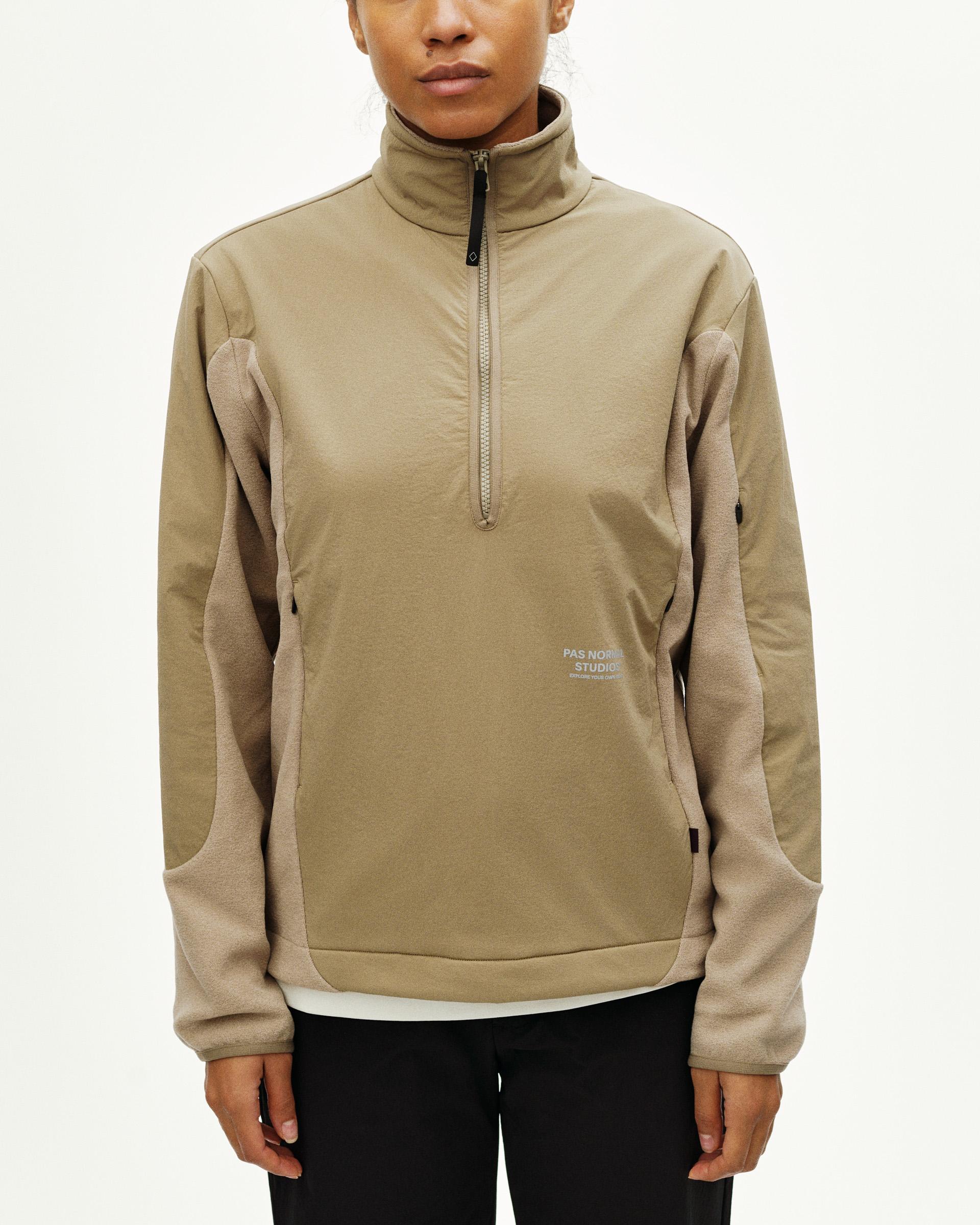 Beige Off-Race Light Fleece half-zip on model with contrast sleeves and quarter zip closure