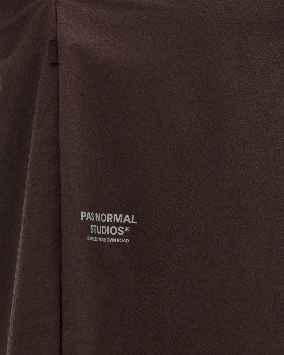 Dark Purple Off-Race Tech Skirt, detail view showing white logo print on fabric