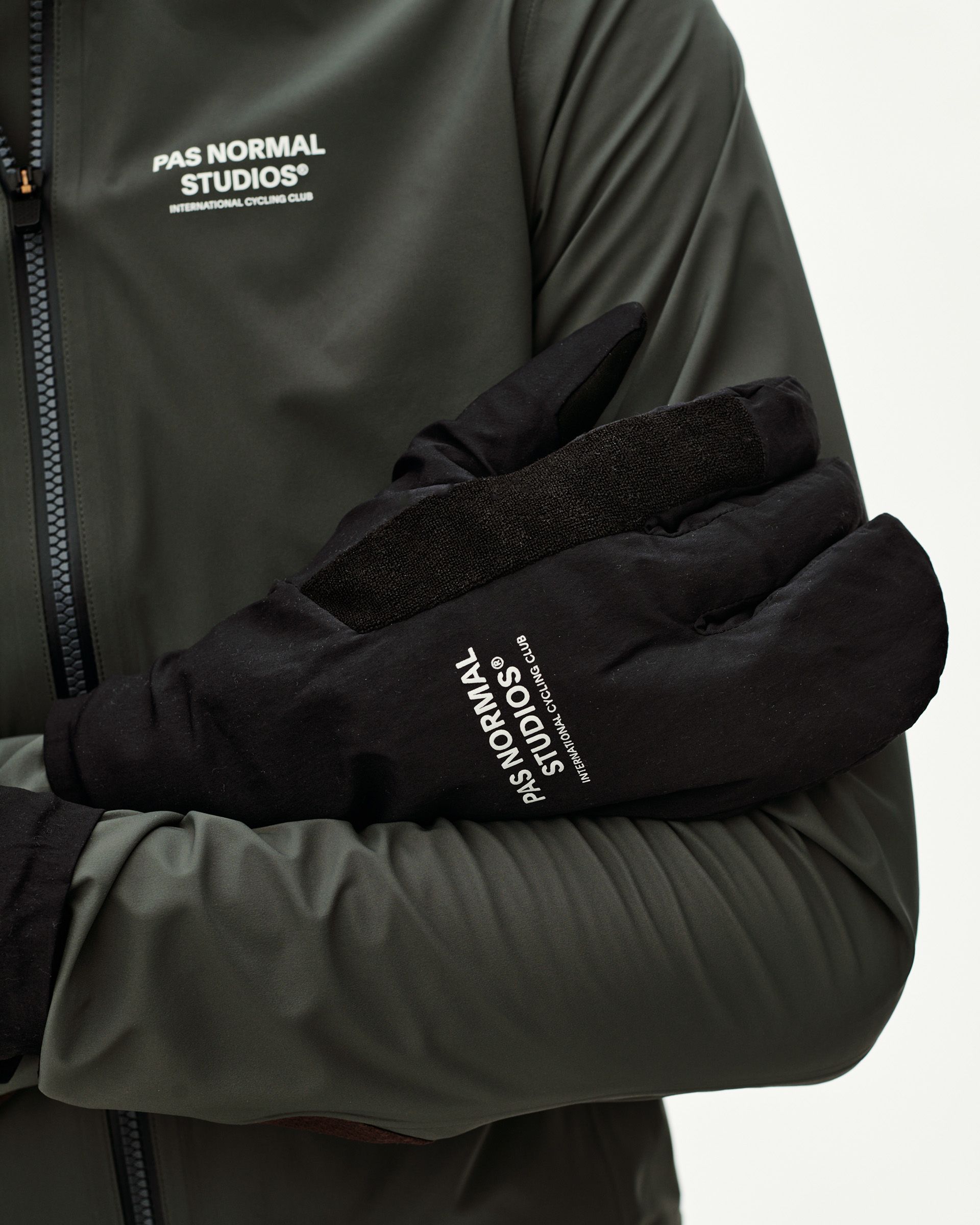 Black Logo Deep Winter Insulated cycling gloves on model, front detail view with white chest logo print