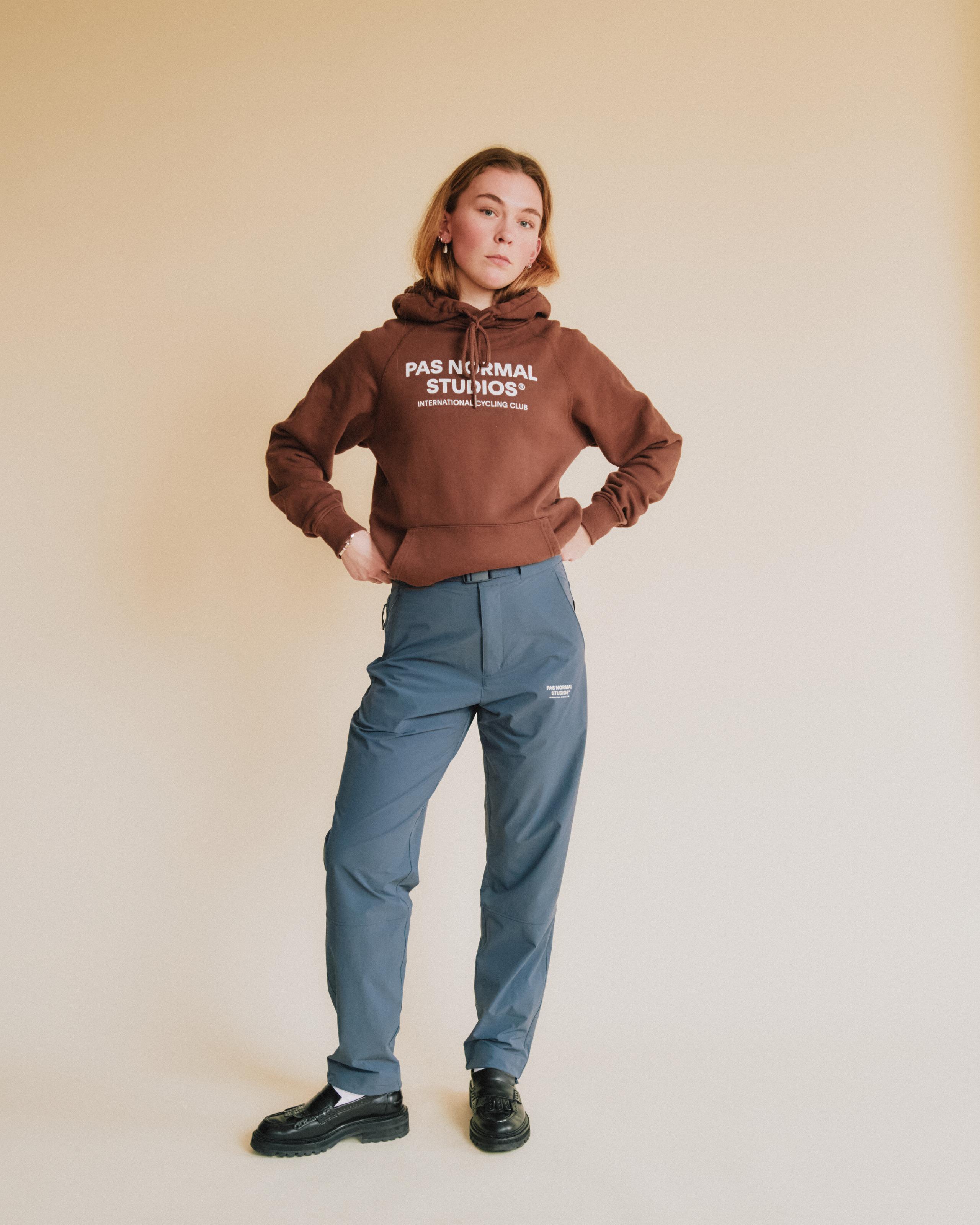 Blue Off-Race pants on model with relaxed fit and elastic waistband