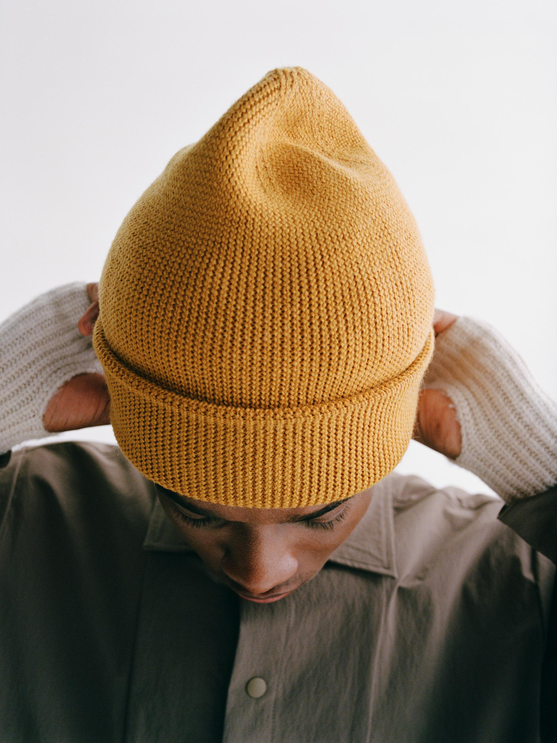 Yellow Off-Race Heavy Knit beanie on model with folded brim and ribbed texture