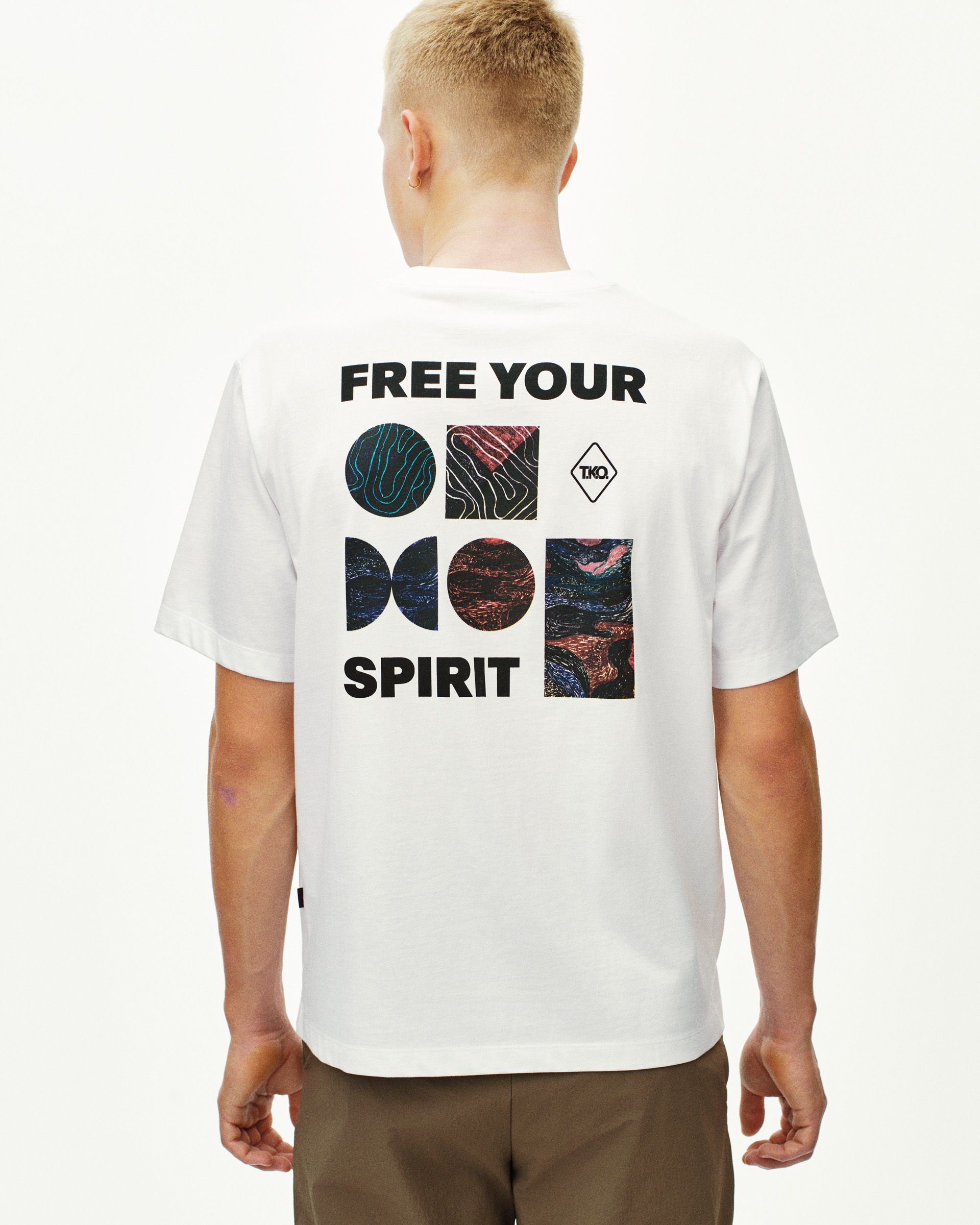 White T.K.O. Off-Race graphic T-shirt on model, rear view with Free Your Spirit back print