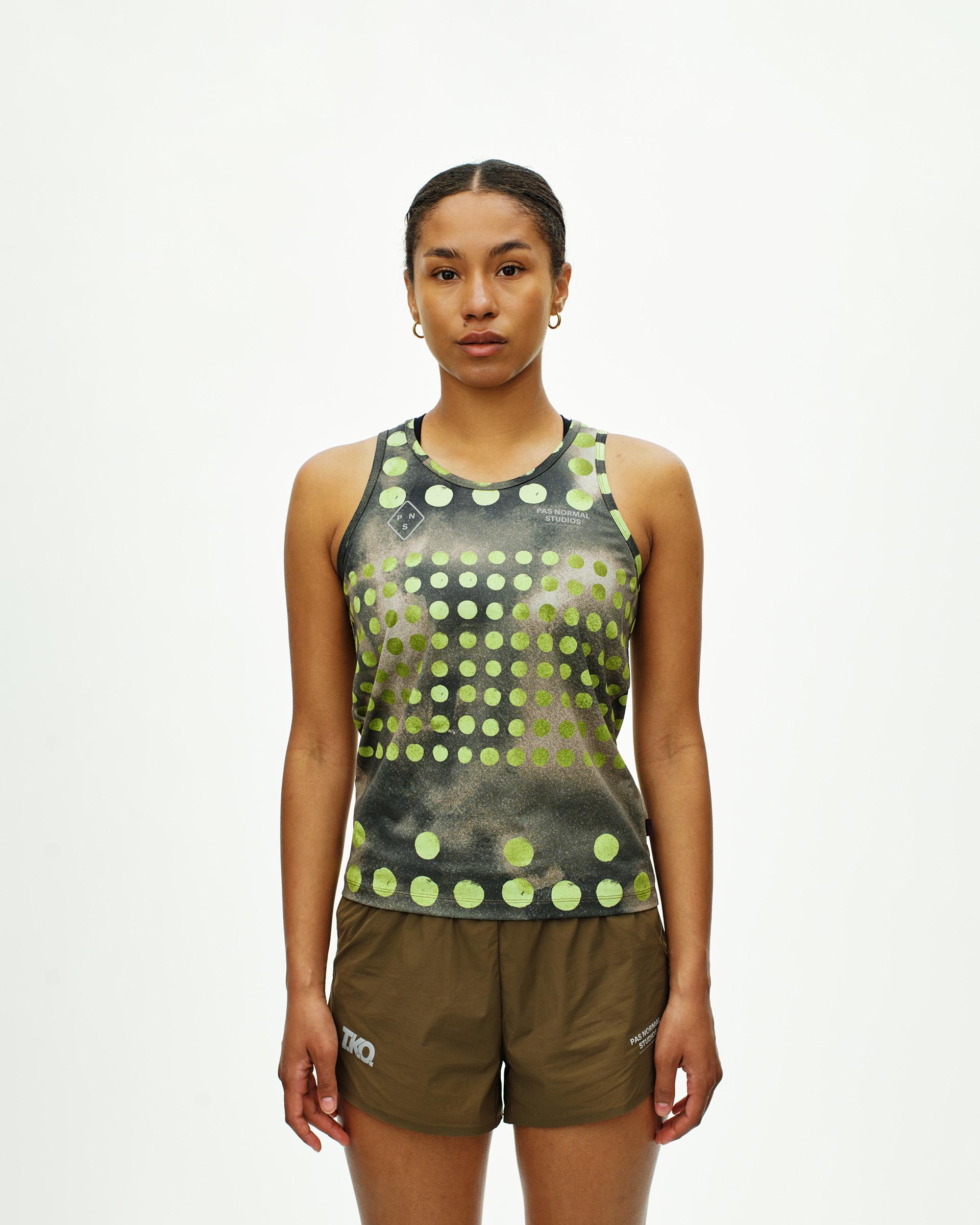 Green T.K.O. Balance singlet on model front view with polka dot print