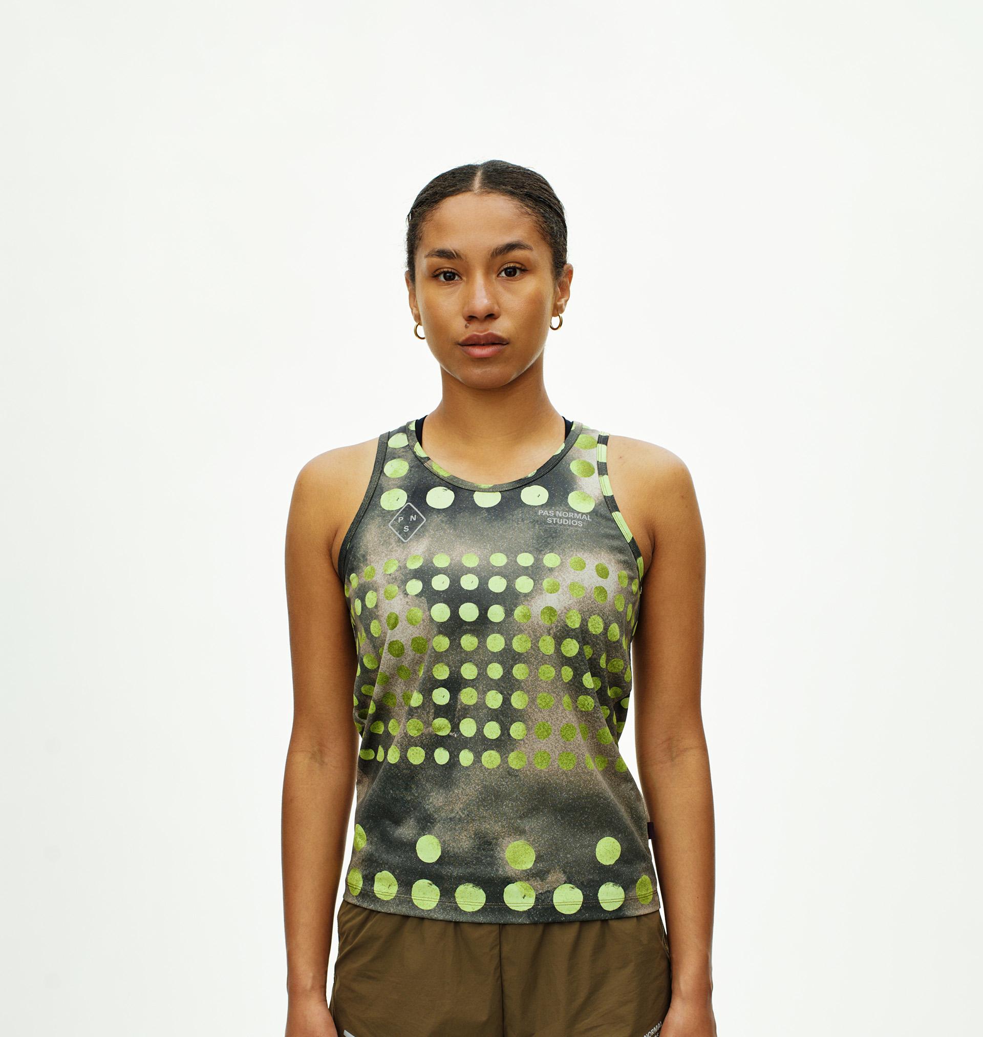 Green T.K.O. Balance singlet on model front view with polka dot print