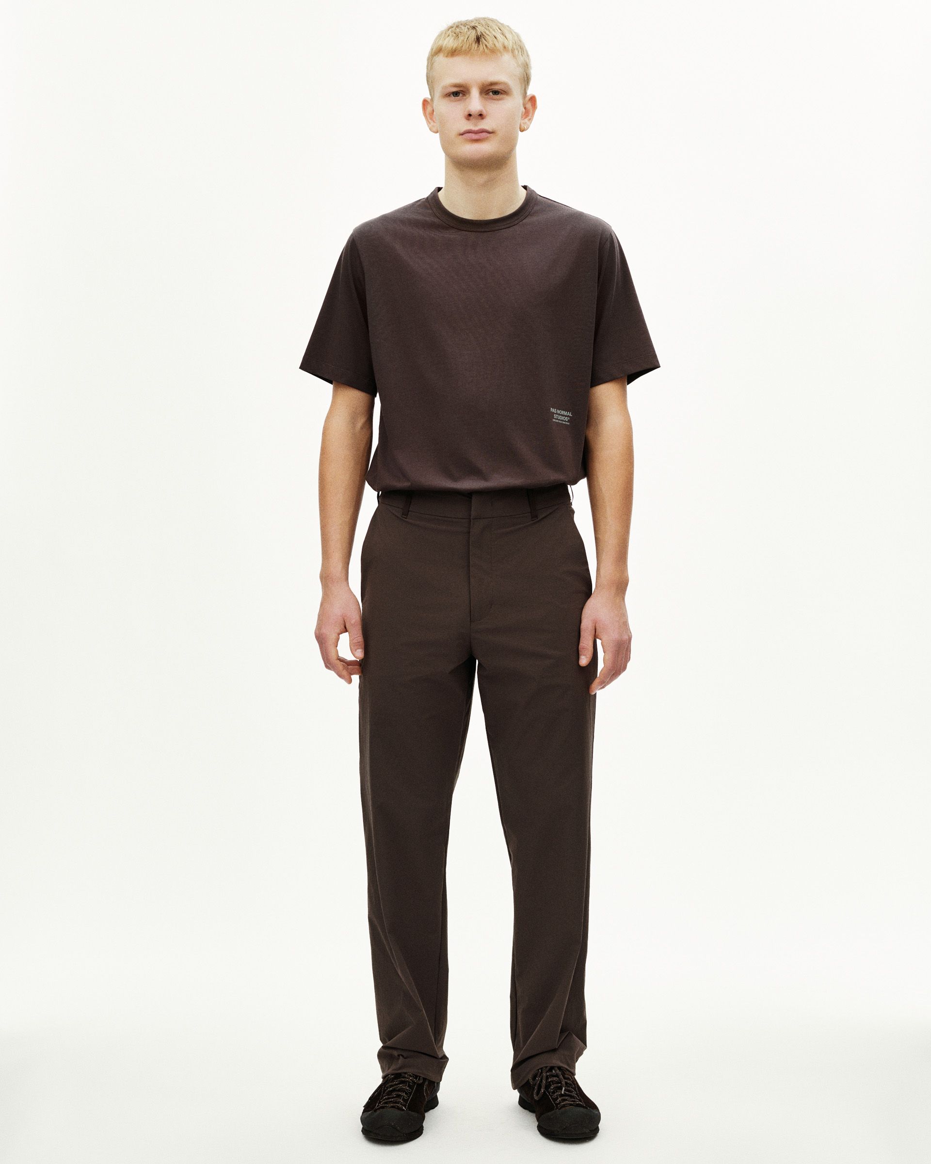 Dark Purple Off-Race Tech pants on model, front view with tailored fit