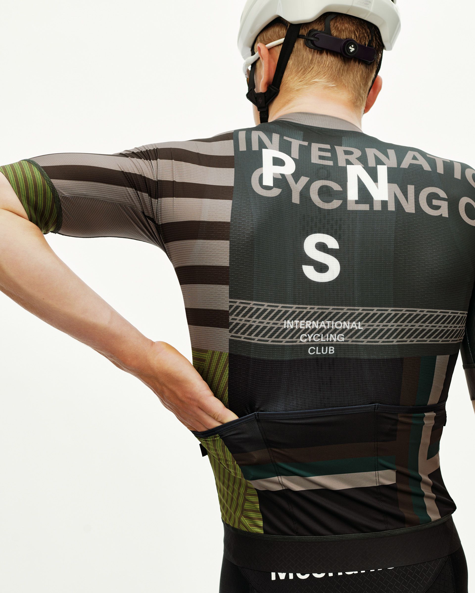 International Earth Mechanism cycling jersey on model, rear view with graphic stripe and International Cycling Club back