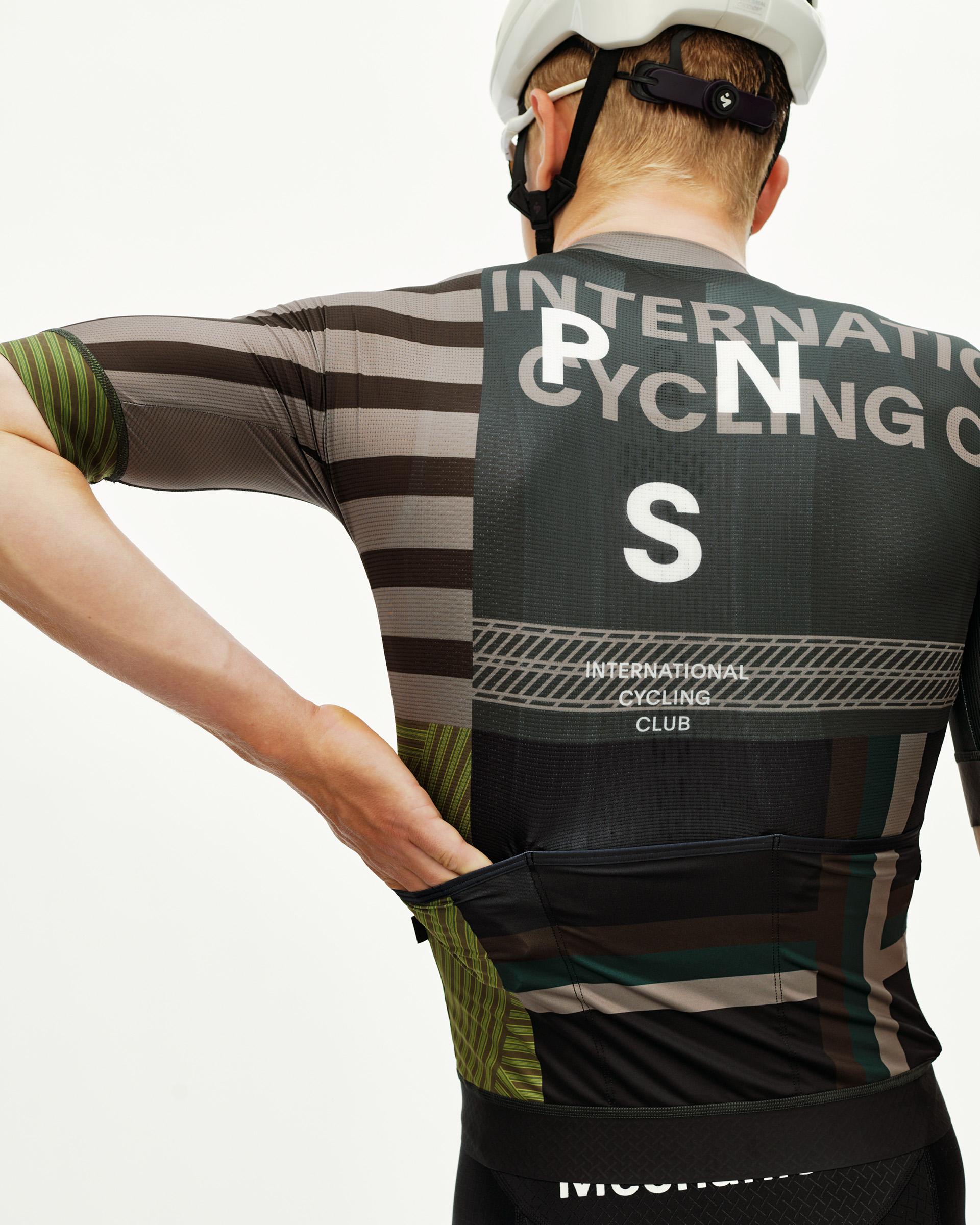 International Earth Mechanism cycling jersey on model, rear view with graphic stripe and International Cycling Club back