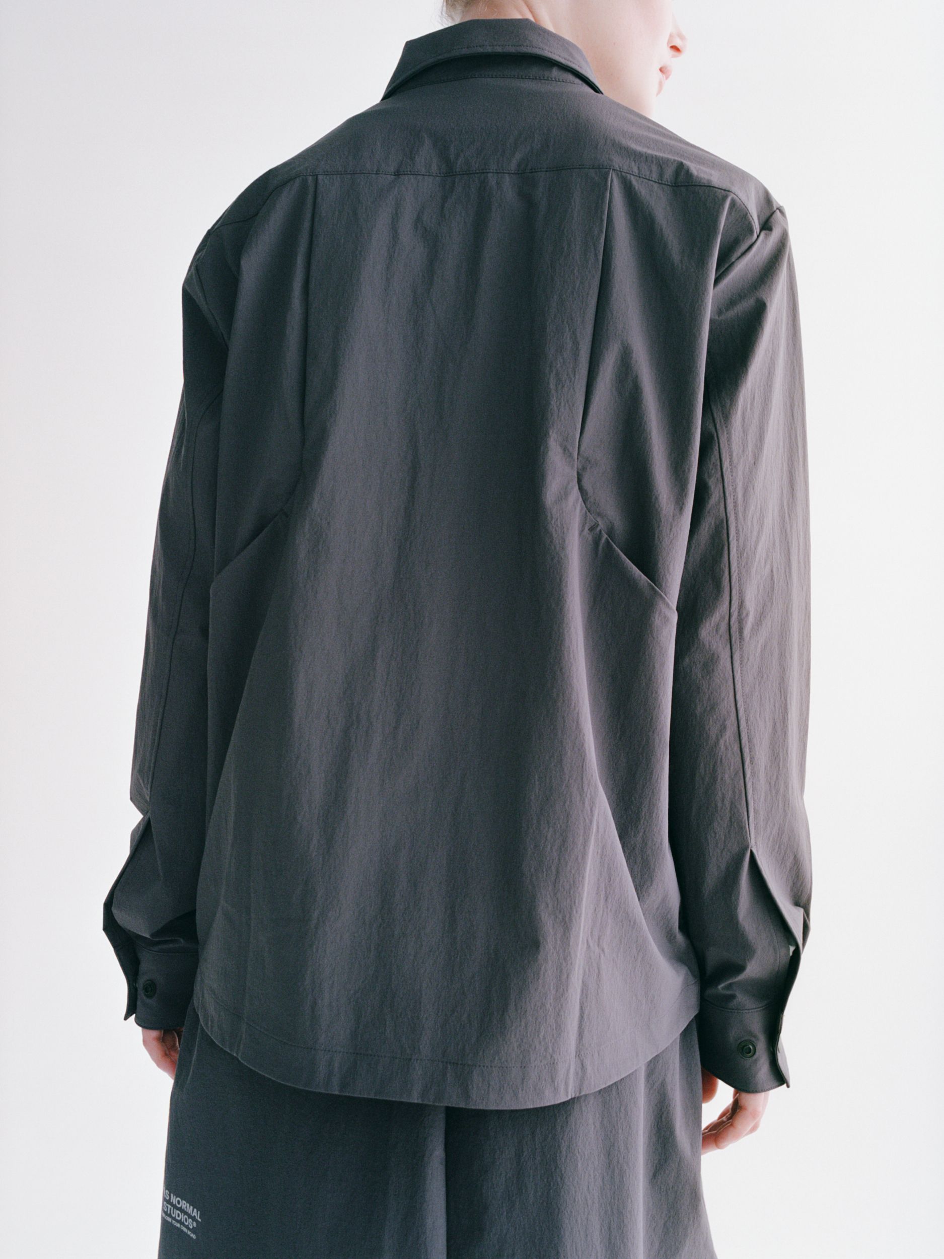 Grey Off-Race Tech Overshirt, rear view on model with collar and button cuffs