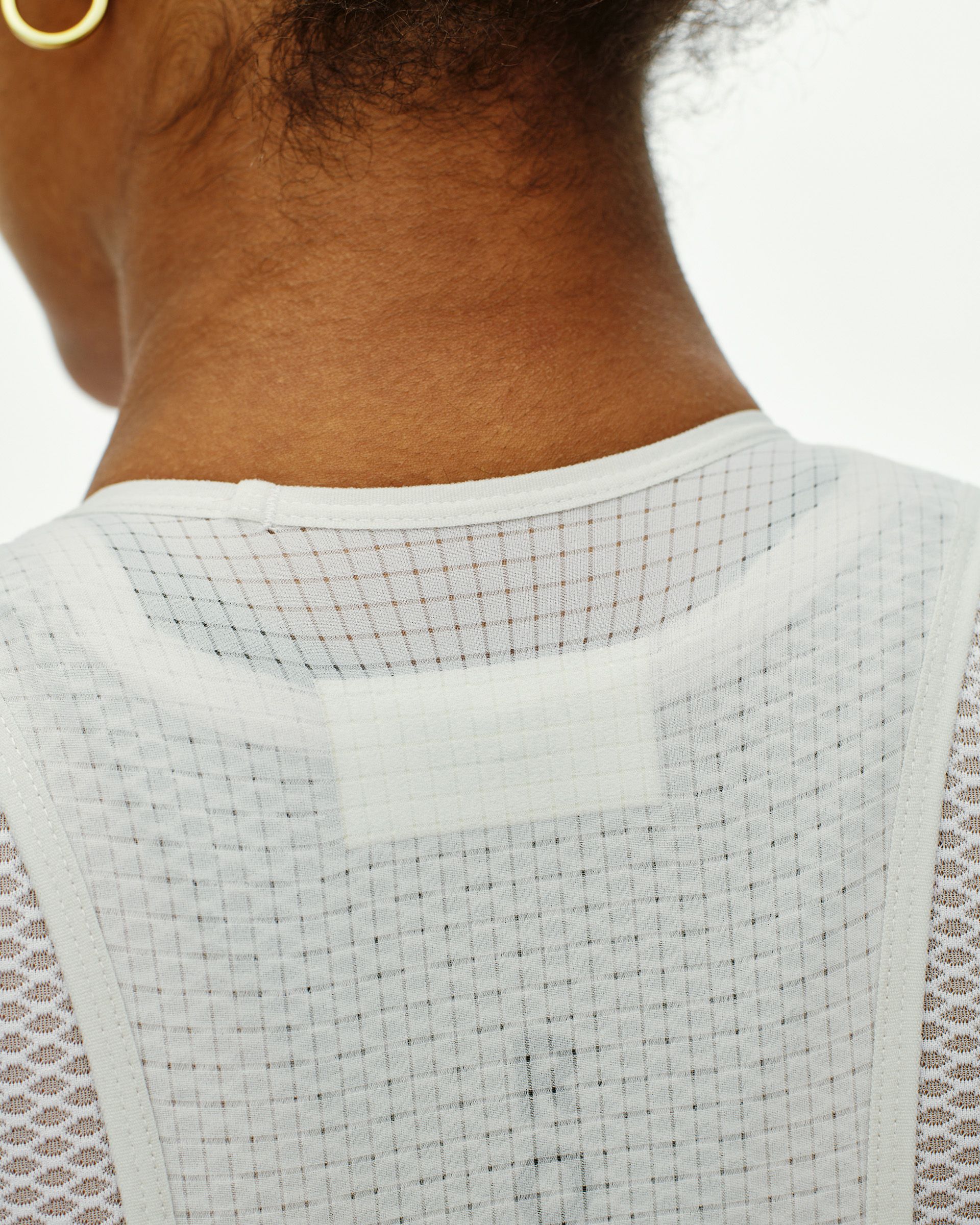Dark Stone T.K.O. Essential Light Cargo bibs, rear view on model with perforated back panel