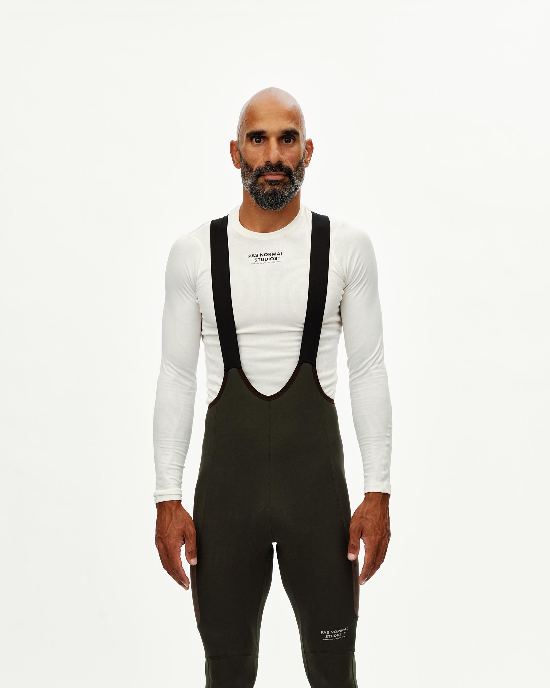 Dark Olive Escapism Long Cargo cycling bib tights on model, front view with black shoulder straps